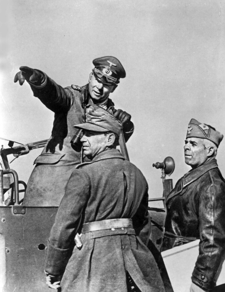  Gen. Erwin Rommel, the Desert Fox, points to a distant location while discussing tactical deployments with subordinates. Rommel was recalled to Berlin in March 1943, and replaced by Gen. Hans-Jürgen von Arnim in command of Axis forces in North Africa. 