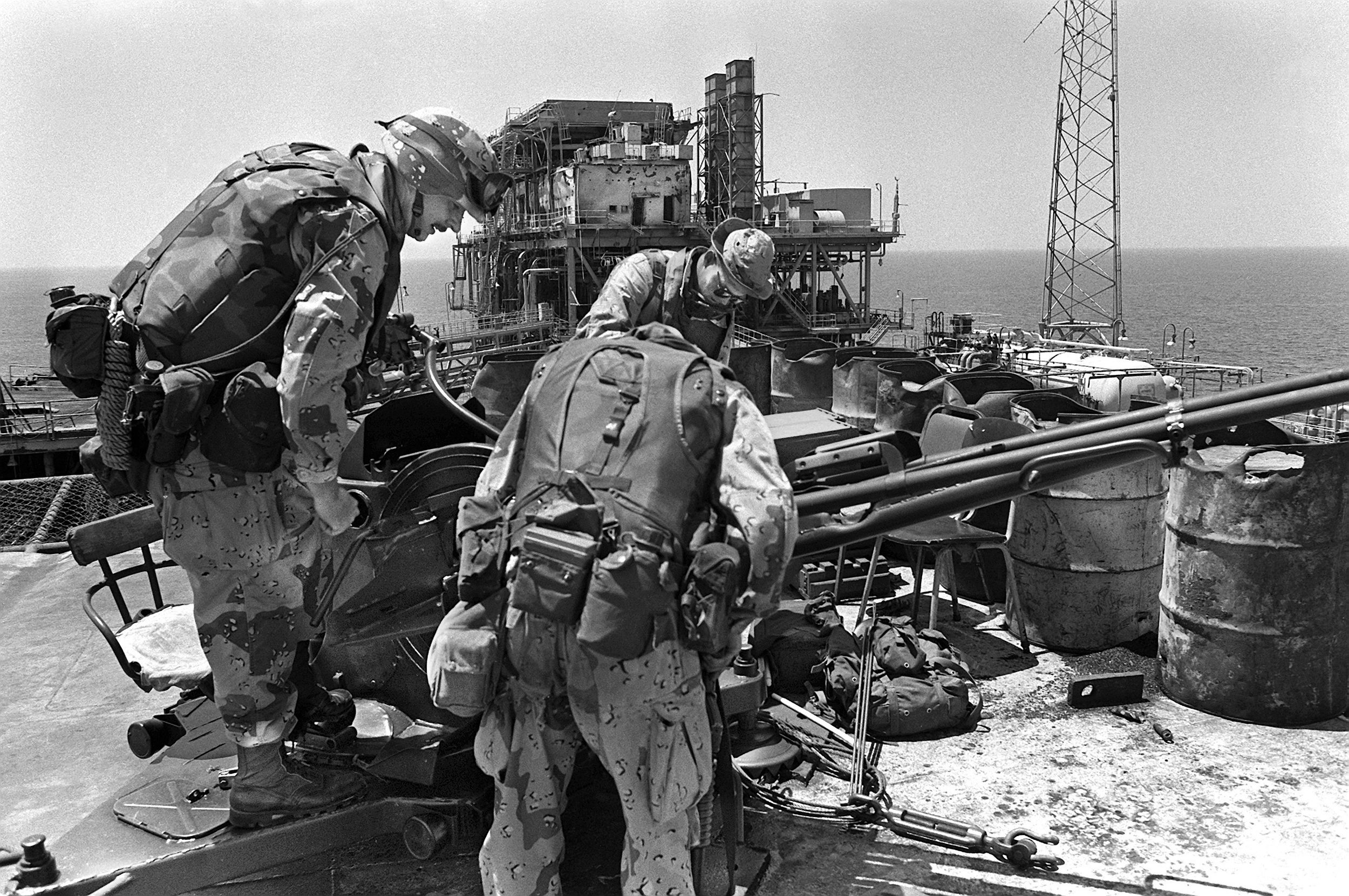 Marines inspect a Soviet ZU-23 anti-aircraft gun on the Sassan oil platform which Iranians had fired at the Marines before being silenced by a BGM-71 Tube-launched, Optically-guided, Wire-guided (TOW) missile fired from a Marine AH-1 Cobra helicopter. The attack was part of Operation Praying Mantis which was launched after the guided missile frigate USS Samuel B. Roberts hit an Iranian mine on April 14, 1988.