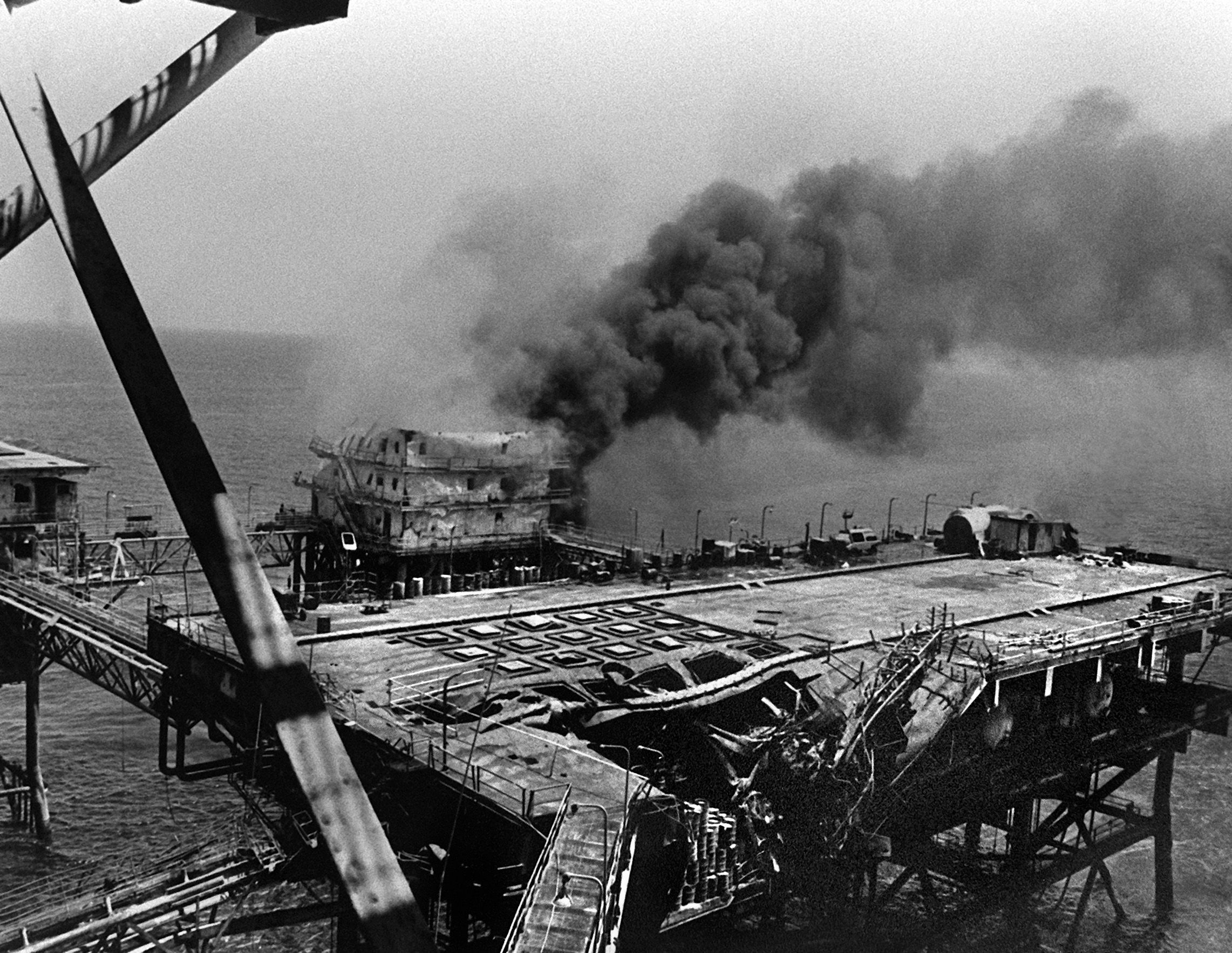 The main building of Iran’s Sassan oil platform in the Persian Gulf is on fire after being hit by guided missiles from a Marine AH-1 Cobra helicopter on the morning of April 18 during Operation Praying Mantis. 