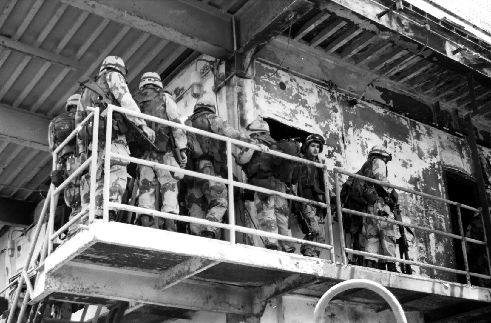 On the morning of April 18, 1988, a U.S. Marine squad from Surface Action Group (SAG) Bravo searches Iran’s Sassan oil platform for intelligence documents and military equipment. Afterwards, the Marines set demolition charges to destroy its production capability. The Navy wanted to prevent a major ecological disaster and had learned in 1987’s Operation Nimble Archer how difficult it was to destroy the steel-lattice platforms by naval fire alone.