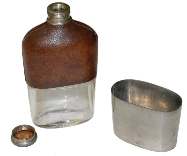 A Civil War era whiskey flask, complete with pewter drinking cup that fits over the bottom of the bottle. 