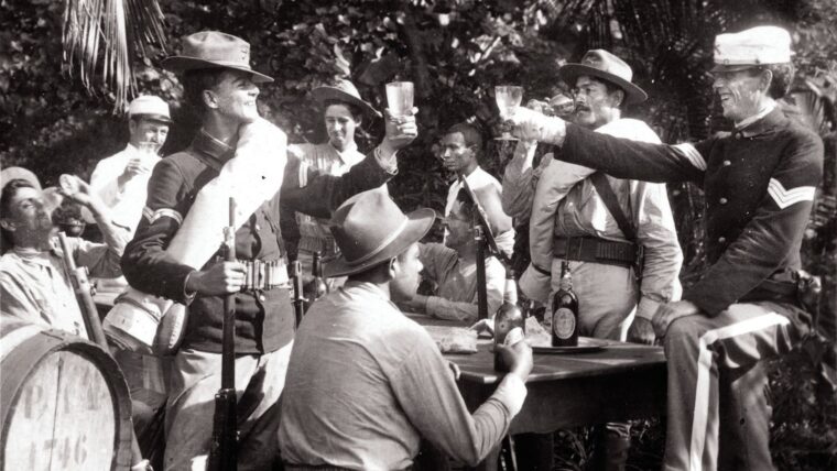 U.S. military personnel in Puerto Rico “drink to the girl [they] left behind” during the Spanish-American War in 1898.