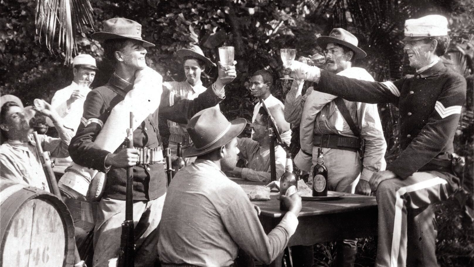 U.S. military personnel in Puerto Rico “drink to the girl [they] left behind” during the Spanish-American War in 1898.