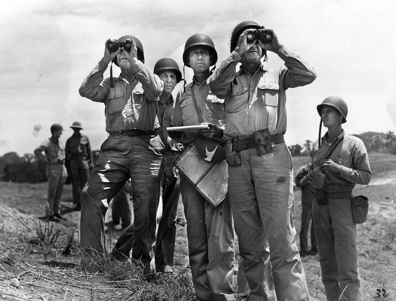  Commanders and staff survey the Guadalcanal battlefront in 1942 during a visit from the Commandant of the Marine Corps. From left, Commandant Lt. Gen. Thomas Holcomb, Col. Clifton Cates, and Maj. Gen. Alexander Vandegrift.