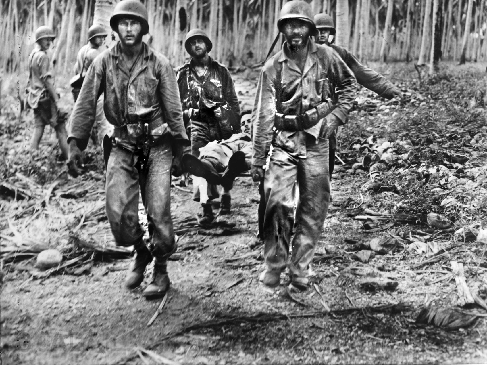Evacuating wounded from the 5th Marine Regiment during the U.S. offensive against Japanese forces near the Matanikau River on Guadalcanal in November 1942.