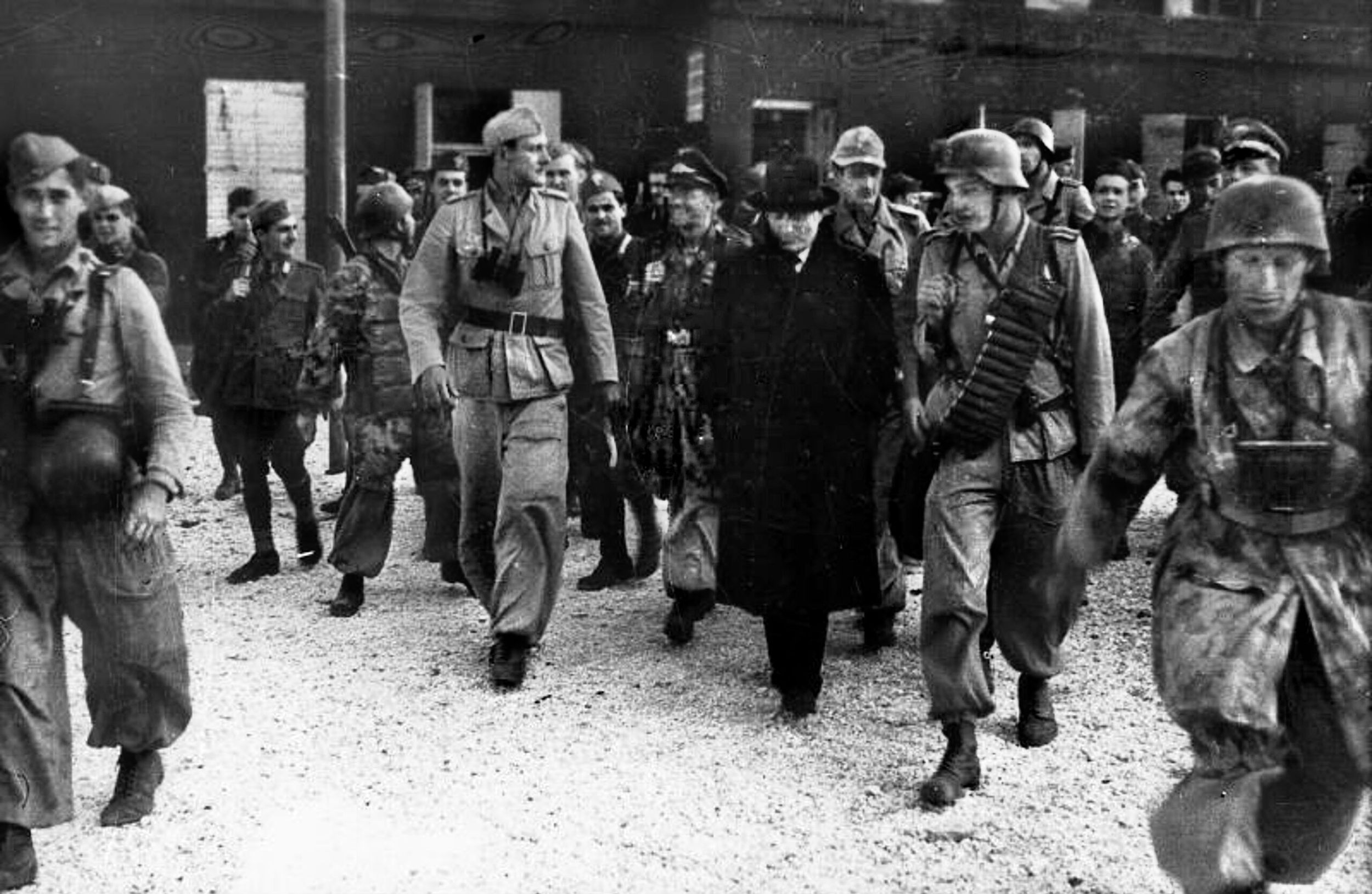 Waffen-SS Captain Otto Skorzeny, center left, escorts Benito Mussolini out of the Hotel Campo Imperatore only minutes after the first gliders landed on Gran Sasso. Although planned as a Fallschirmjäger operation, Skorzeny and 16 of his SS troops were added to the mission at the insistence of Reichsführer Heinrich Himmler. With photographs of Skorzeny shepherding the rescued dictator, Himmler and propaganda minister Joseph Goebbels made sure Skorzeny and his special forces got full credit for the Operation Oak rescue.
