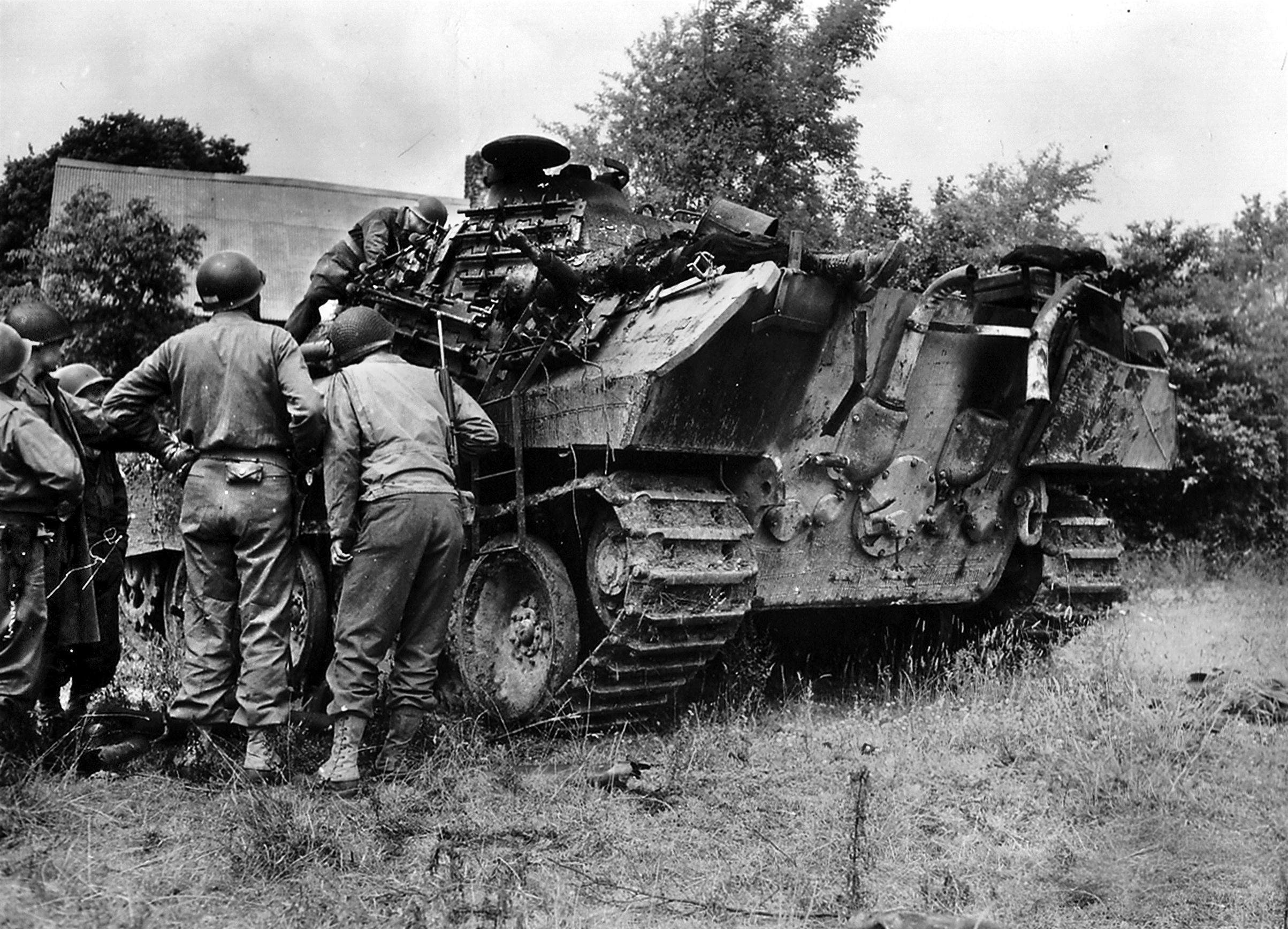 GIs from the 9th Infantry Division gather around Panther Ausf A knocked out during combat in Normandy. On July 7, Captain George Stallings Jr. and the 2nd Battalion (33rd Armored Reg.) were ordered to St Gilles to take on a battlegroup from the 275th Infantry Division along with elements of the 2nd SS Panzer and Panzer Lehr Divisions. This latter had been a training unit in Germany before being sent to Normandy against the expected Allied landings.