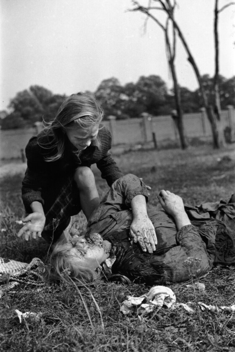 Kazimiera Kostewicz kneels over the body of her older sister, Andzia, killed by strafing German aircraft in Warsaw on September 13, 1939. American photographer Julien Bryan’s photo, smuggled out of Nazi-occupied Poland, shocked the world.