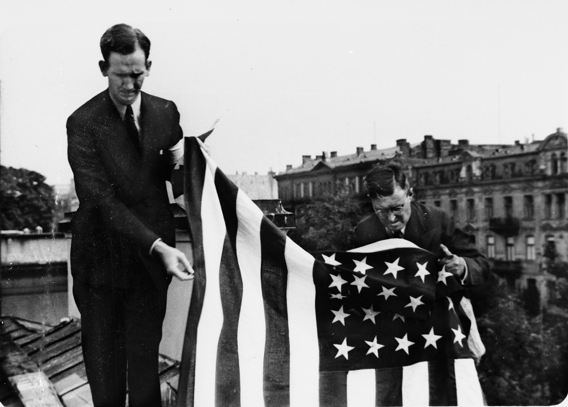 When news came of the first German troops entering Warsaw, consular staff hung American flags from every window of the American Embassy, spreading the largest on the roof to warn off German pilots acting as artillery spotters.
