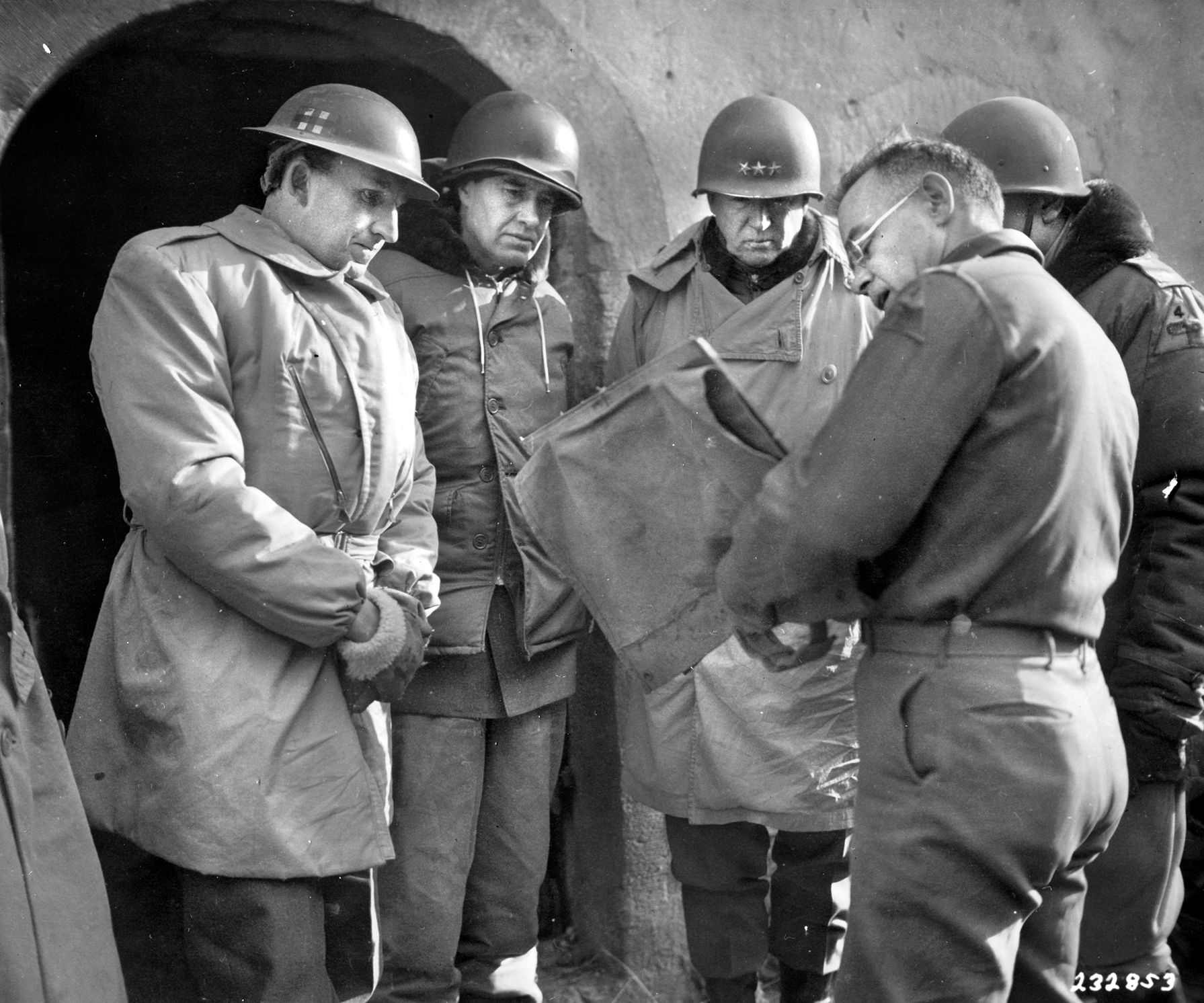 Jeeps with the 4th Armored Division rumble through the muddy streets of bombed-out Dieuze, France, west of Mittersheim. Despite the cold, inhospitable conditions, American forces continued to drive towards Germany. In Moscow, Ambassador Harriman would report to Joseph Stalin that the Americans were working hard to win the war.
