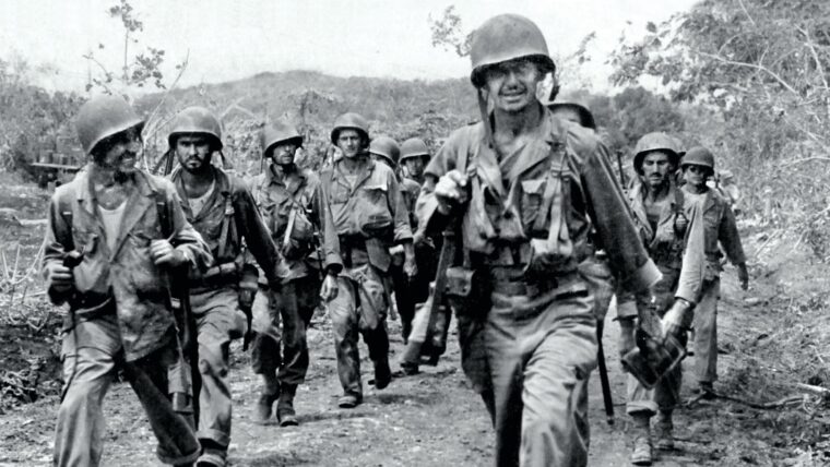 Soldiers from the U.S. Army’s 27th Infantry Division move forward on Saipan in the summer of 1944. The U.S. forces tasked with capturing the Japanese island and its airfields would be the first to face a gyokusai (”smash the jewel”) suicide attack—not just the frenzied charge that accompanied the Japanese battle cry “Tennōheika banzai!” (long live His Majesty the Emperor). In a July 7 attack seeking to fight until their own forces were annihilated, as many as 4,000 Japanese soldiers died, while American forces suffered 1,000 casualties, including some 400 killed.