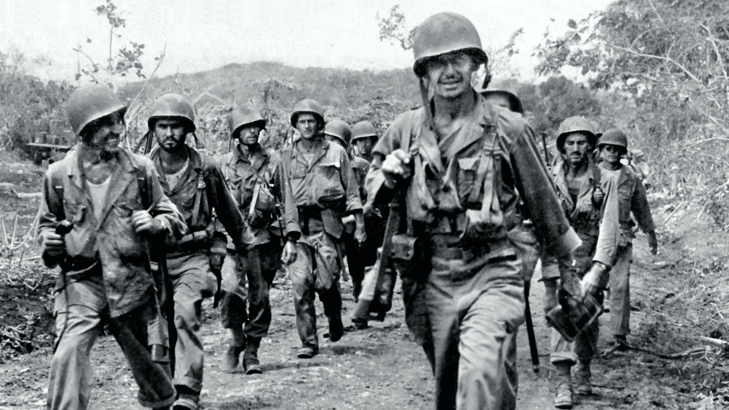 Soldiers from the U.S. Army’s 27th Infantry Division move forward on Saipan in the summer of 1944. The U.S. forces tasked with capturing the Japanese island and its airfields would be the first to face a gyokusai (”smash the jewel”) suicide attack—not just the frenzied charge that accompanied the Japanese battle cry “Tennōheika banzai!” (long live His Majesty the Emperor). In a July 7 attack seeking to fight until their own forces were annihilated, as many as 4,000 Japanese soldiers died, while American forces suffered 1,000 casualties, including some 400 killed.