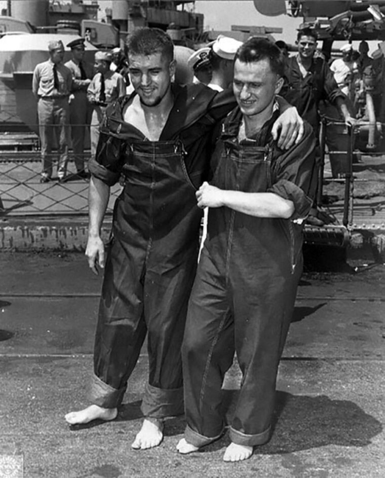 From left, German prisoner of war Werner Drechsler, recovering from a bullet to the knee, disembarks from the USS Osmond Ingram with the help of Herman Polowzyk at Naval Operating Base Norfolk, Virginia, on June 20, 1943. Drechsler, who cooperated with the U.S. and spied on incoming German prisoners for seven months, was killed by his countrymen when he arrived at POW Camp Papago Park.