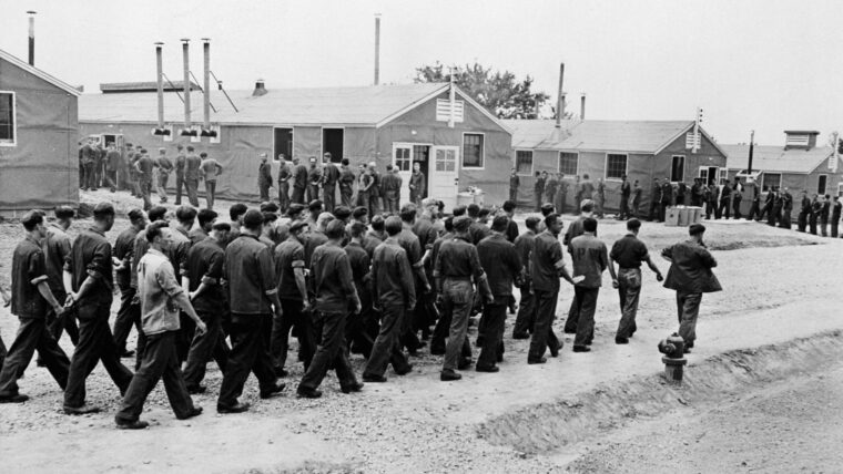 German POWs march to their barracks at one of the many POW camps in the United States.