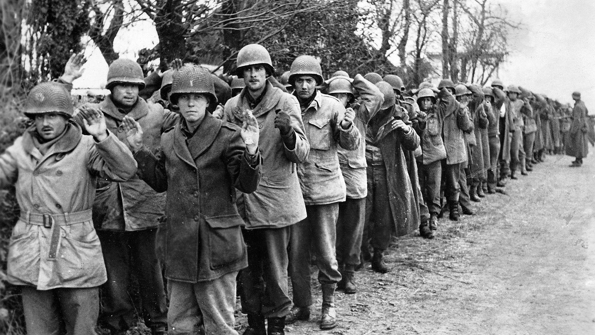 A platoon of green troops from the U.S. 106th Infantry Division, somewhere near St. Vith, Belgium. Expecting to occupy a quiet sector of the Allied line in December 1944, the “Golden Lions” found themselves in the path of Hitler’s last major offensive—Unternehmen Wacht am Rhein (Operation Watch on the Rhine).