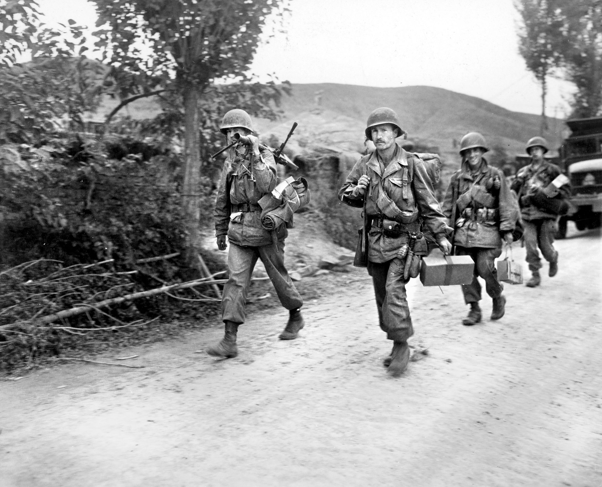Men of the 19th Regiment, 24th Division, part of the Eighth Army, commanded by Lt. Gen. Walton Walker, move to the front lines during the advance from Pusan. The division was caught in the Battle of the Ch’ongch’on River that began with massive Chinese attacks on November 25, 1950. 