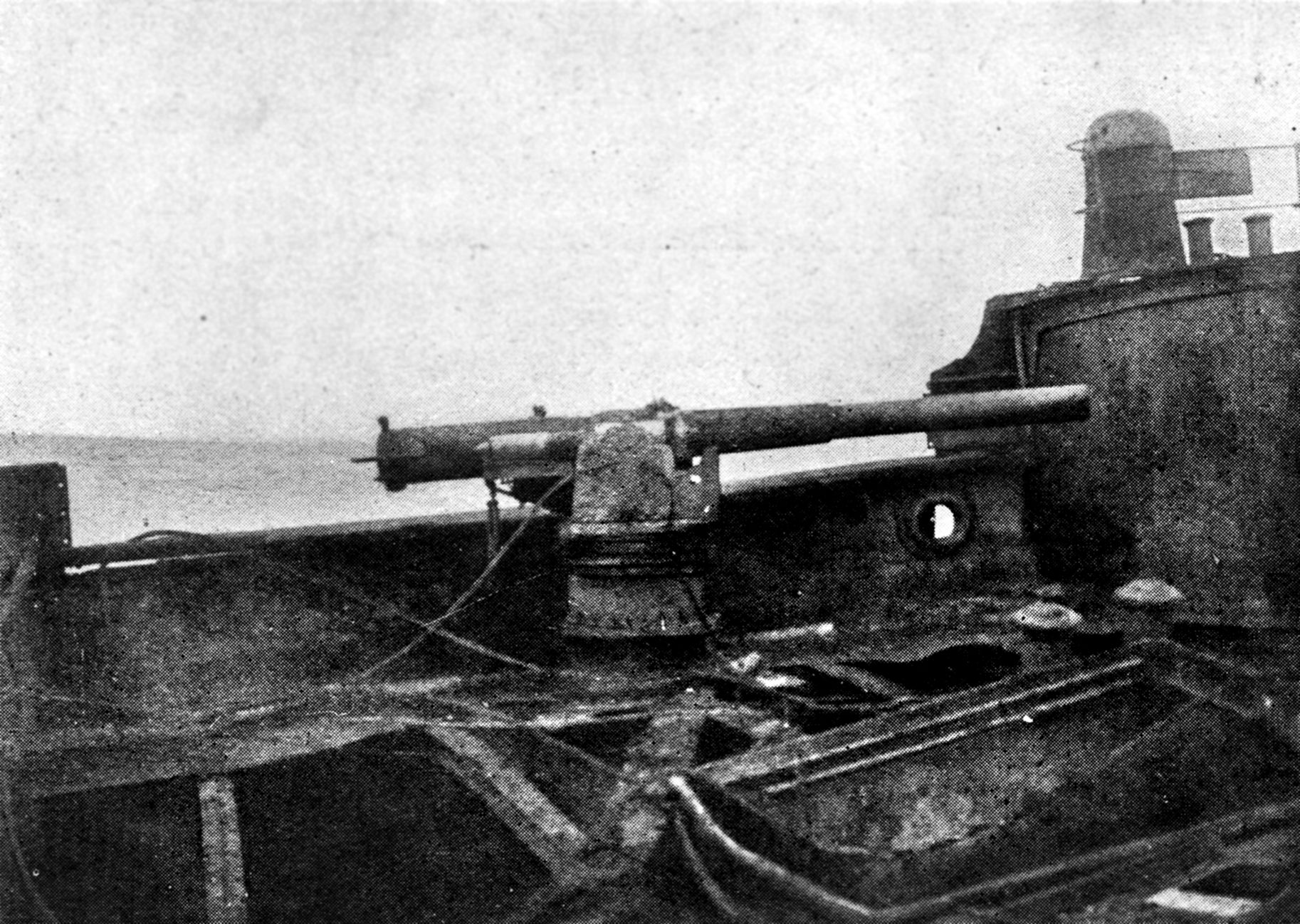 One of the Seeadler’s two 105-mm guns, which were kept hidden behind hinged gunwales until needed. After the ship struck a reef and foundered in the Society Islands in the South Pacific in August, the crew disabled the guns.
