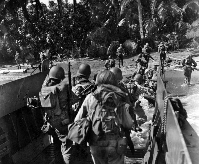 The 185th Infantry Regiment (40th ID) hits the beach in an LCVP [Landing Craft Vehicle, Personnel] during amphibious training on Guadalcanal in the Solomon Islands in early March 1944.