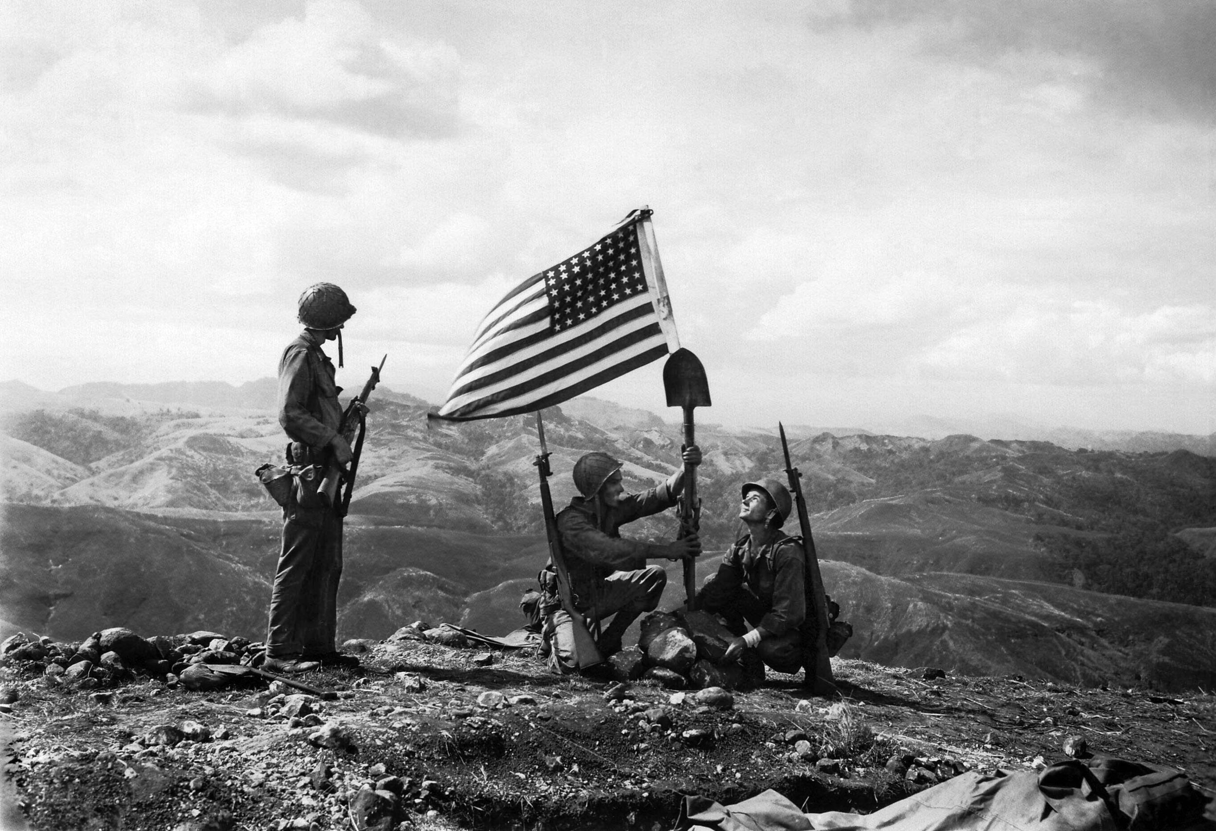 The 185th Infantry Regiment plants the American flag on top of Gusi Hill (Hill 1700) on February 25, 1945. The 40th ID took part in some of the fiercest fighting in the Philippines in the month-long fight for the Bamban Hills, a strategic area for the Imperial Japanese Navy as the headquarters for the 1st Combined Air Fleet.