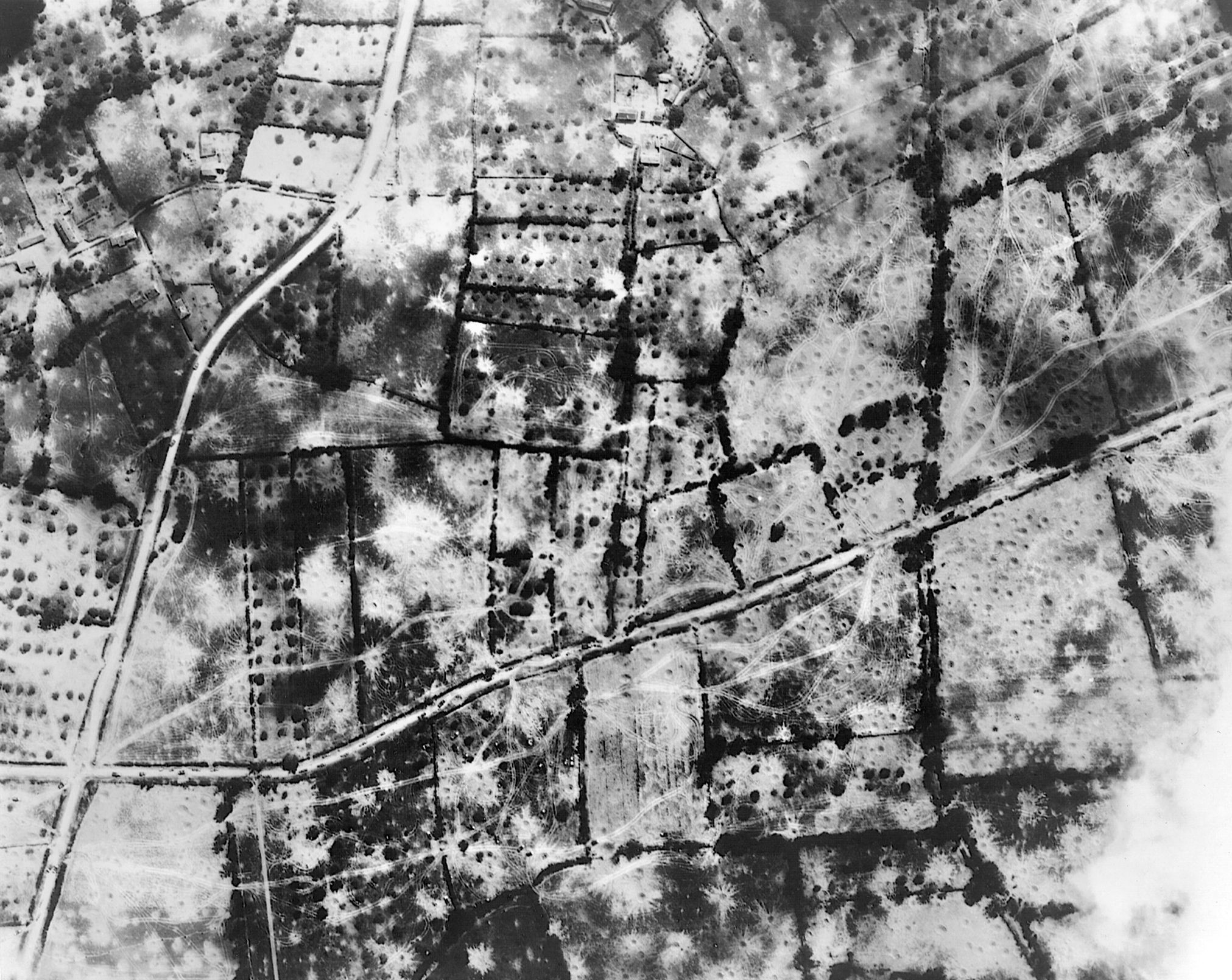 An aerial photograph of the territory after the Cobra bombings showing the immense and concentrated destruction.