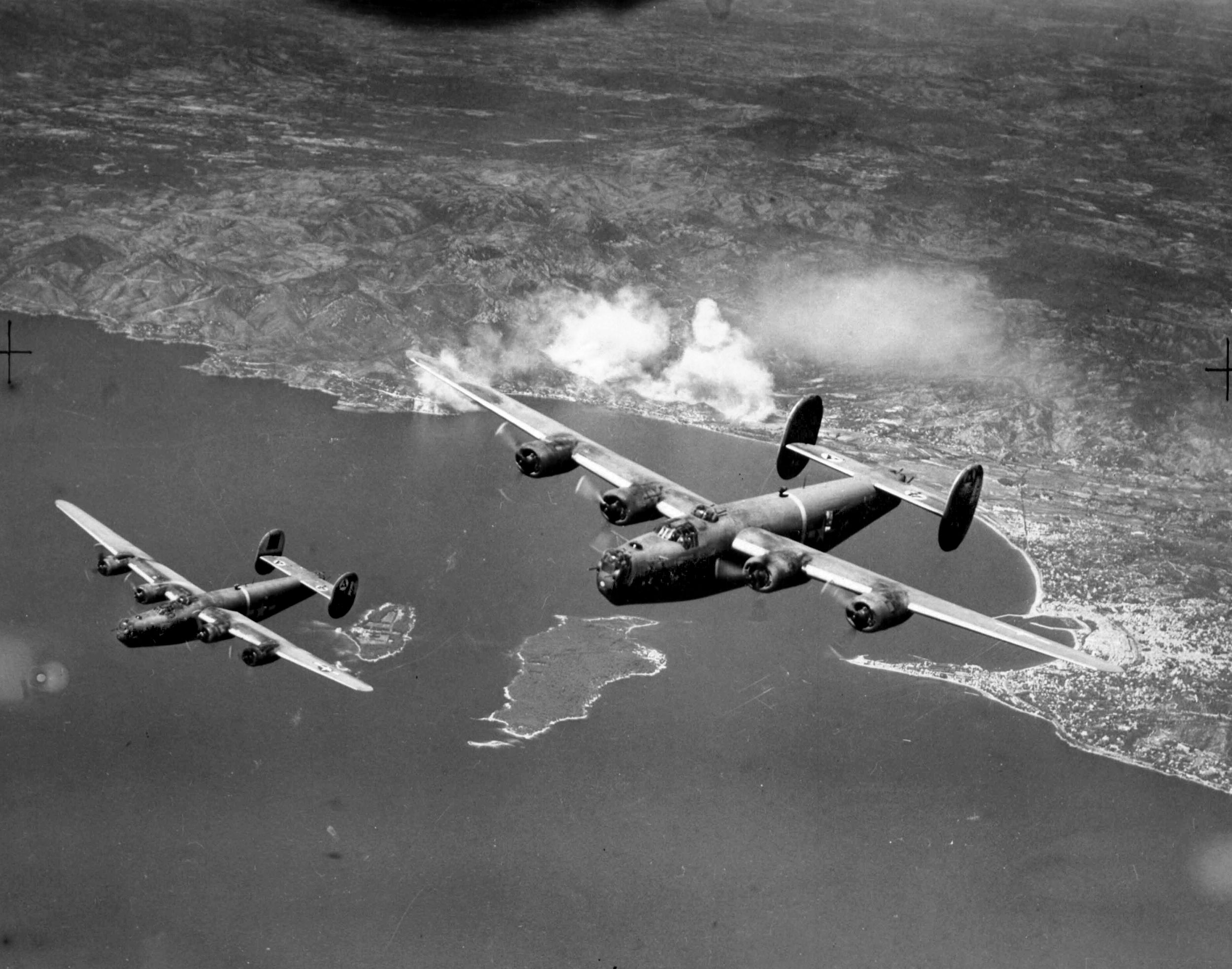 As part of Operation Cobra, American Consolidated B-24 bombers return to England from a run over the battlefront at St. Lo, France, to aid Lt. Gen. Omar Bradley’s Twelfth Army in breaking out of the Cotentin Peninsula. During the operation more than 1,500 aircraft dropped more than 4,000 tons of ordnance on the German front lines.
