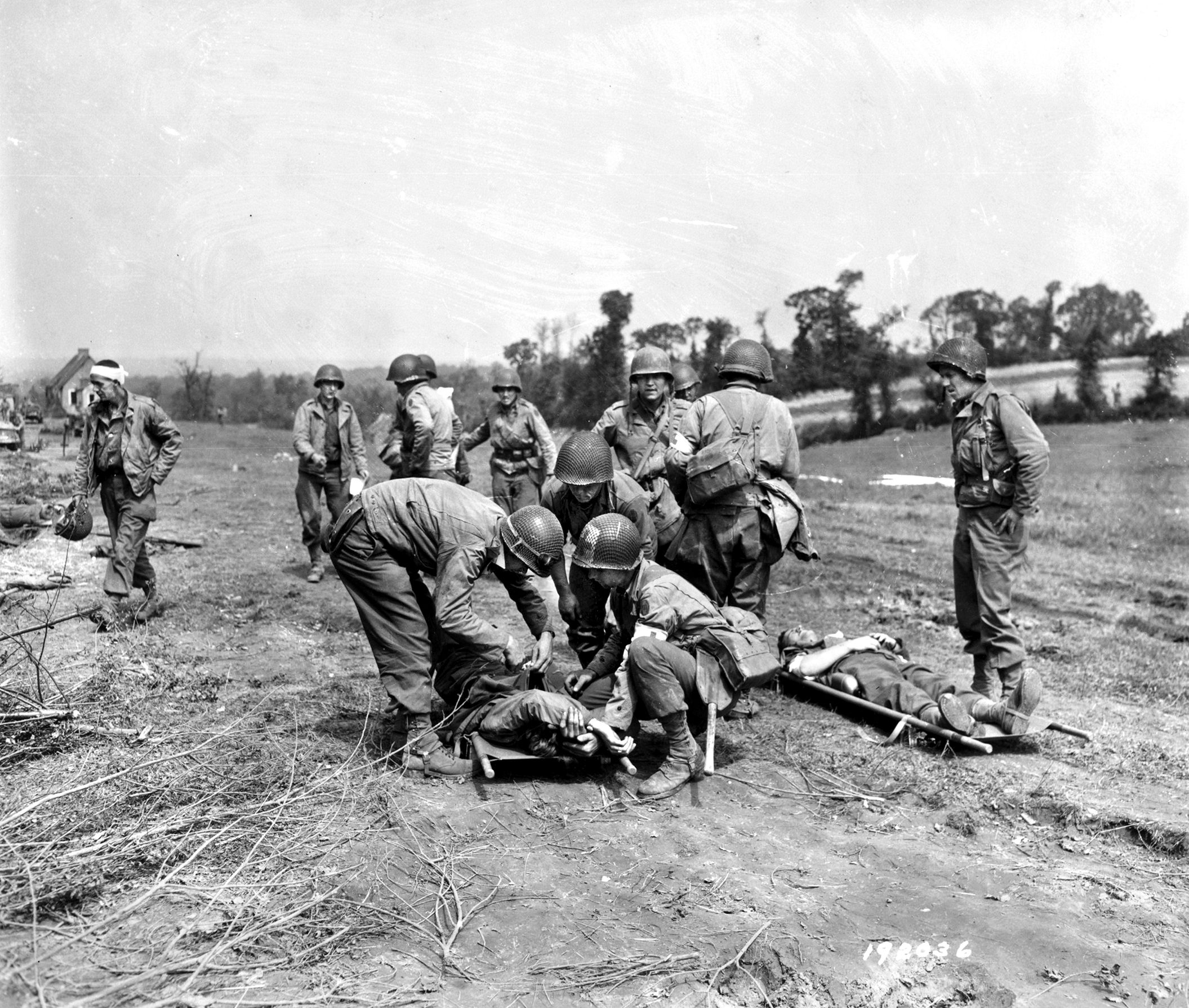 Army medics tend to some of the 131 30th Division GIs wounded by bombs falling short on July 24 during Operation Cobra. A total of 111 Americans were killed by friendly fire, including Lt. Gen. Leslie J. McNair who had come to Europe to assume command of the newly forming American Ninth Army. Some 490 were wounded. 
