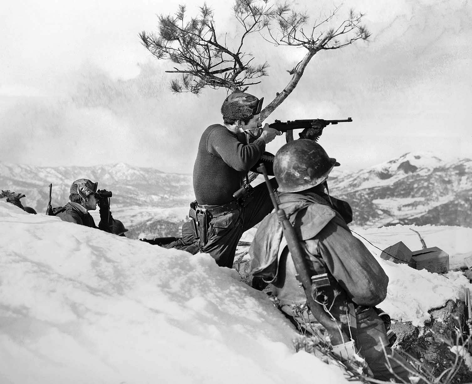 In December 1951, SFC Jack McGerinnis of the 23rd Infantry Regiment provides suppressive fire with his M-2carbine near Kumhwa, part of the Chinese and North Korean strategic staging area known as the “Iron Triangle.” Almost a year after Chipyong-ni, the 23rd IR were veteran “hill fighters”in the terrain around the 38th Parallel.