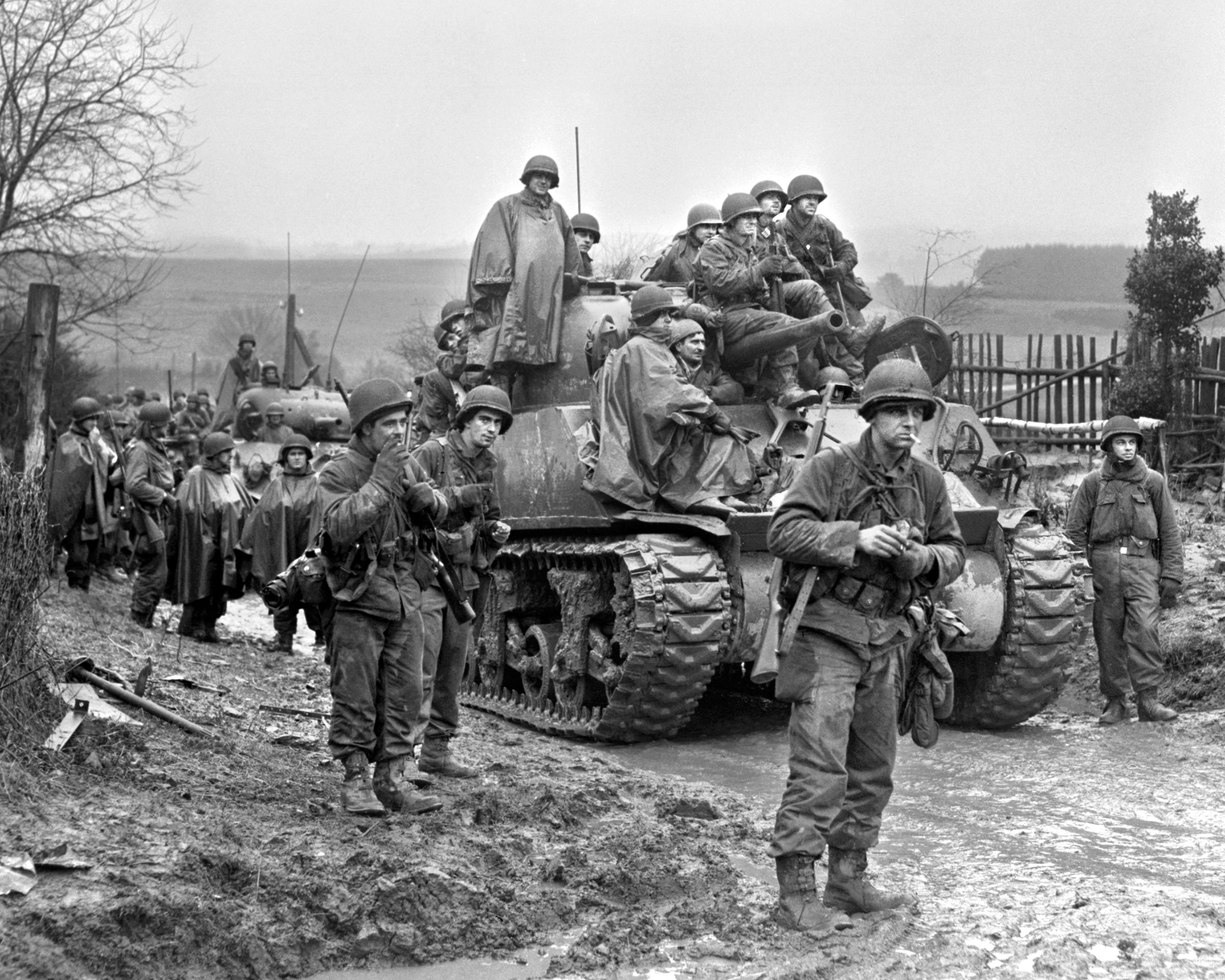 Soldiers of the 2nd U.S. Infantry Division aboard armor from the 741st Tank Battalion prepare to move on to Harscheid, Germany. The 741st was attached to the 2nd Division, and fought together against Rudolf Jackl’s Fallschirmjäger unit in Normandy following D-Day.
