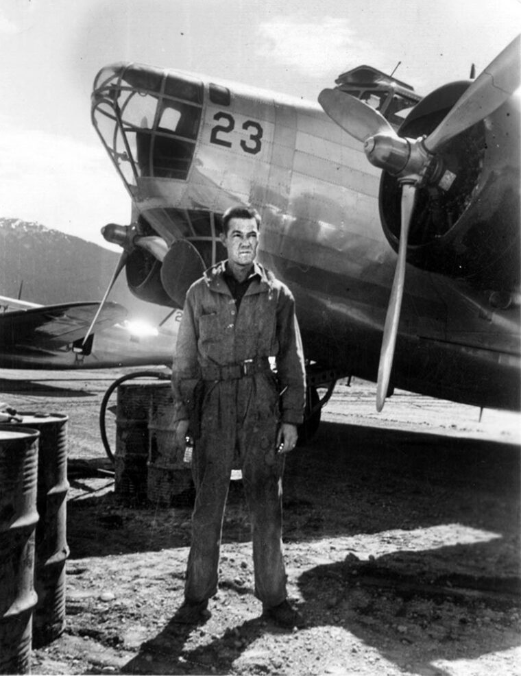 An unidentified serviceman stands before the looming nose of a Douglas B-18 Bolo. During the early, uncertain days of the Pacific War, these bombers were the thin line of defense protecting the Alaskan frontier.
