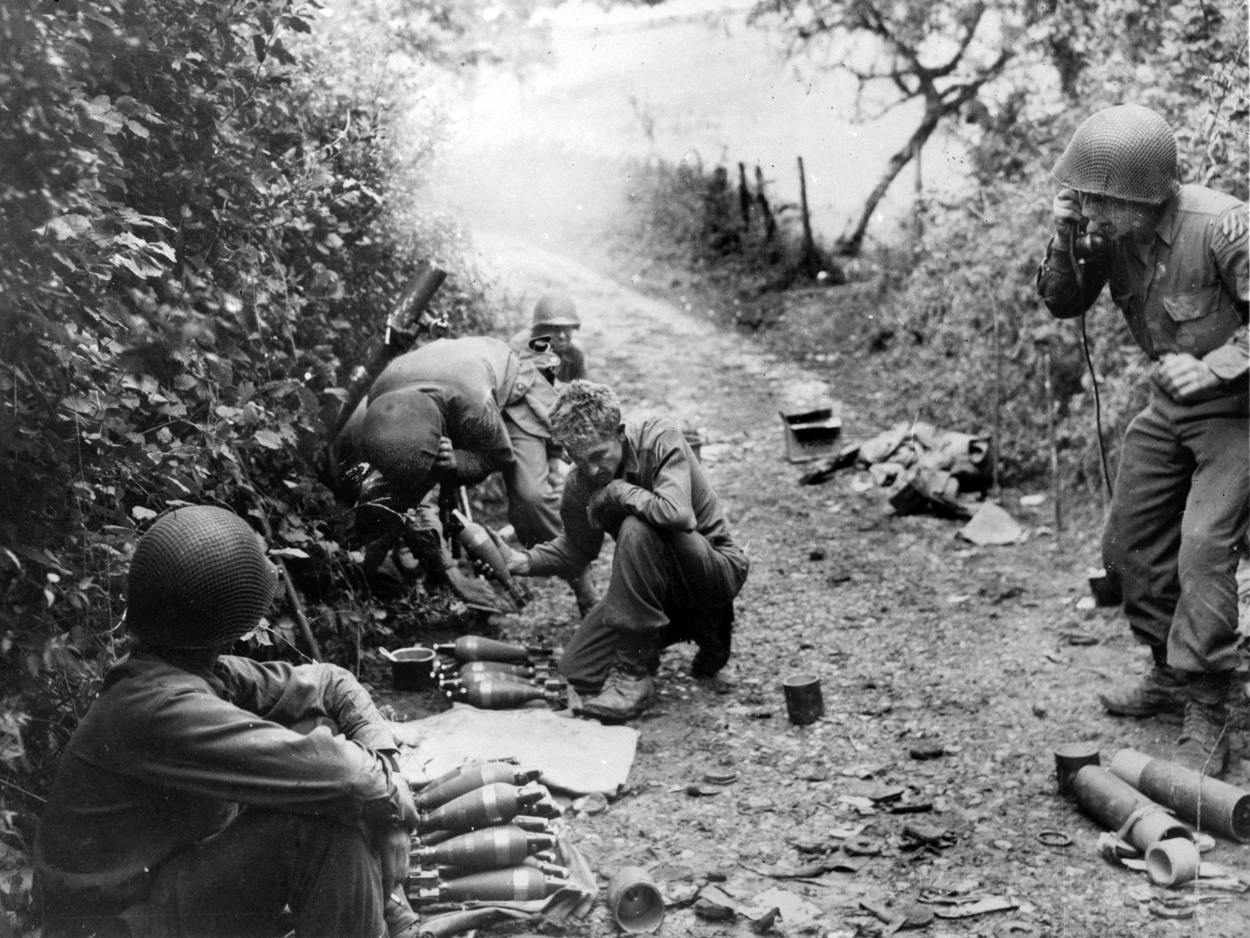 “Hip-pocket artillery” like this 3rd Infantry Division mortar squad was the decisive factor during the grueling assault on the quarry at Cleurie. They saturated the enemy positions with high explosives, stripping away the mountain cover and pinning the German defenders in their bunkers.