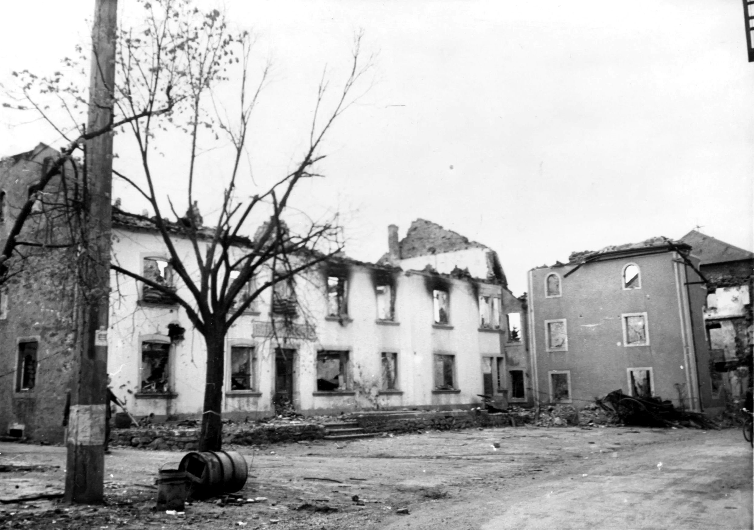 The Hotel Schmitz, in the small Luxembourg village of Hosingen, served as a U.S. Army Command Post (CP) at the opening of the German Ardennes Offensive. When Company K, 110th Infantry, finally ran out of ammunition on December 18, 1944, the Germans had to use Panzer IV tanks to fire point-blank into the hotel’s upper floors to force a surrender, virtually destroying the building. 