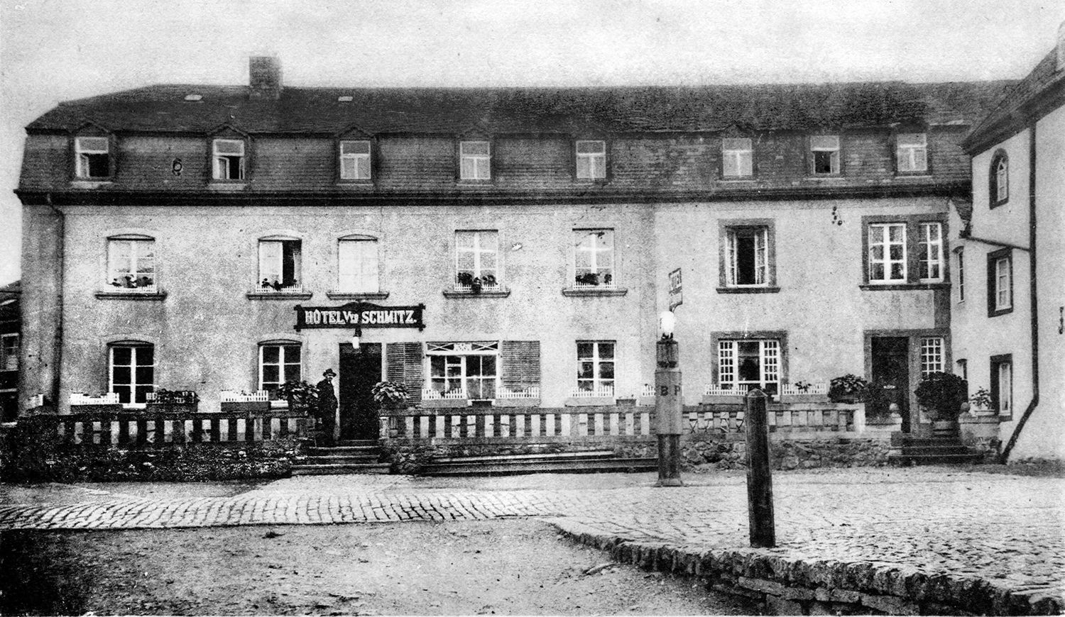 A photo of Hosingen’s Hotel Schmitz, one of the largest stone buildings in the village, taken before the war.