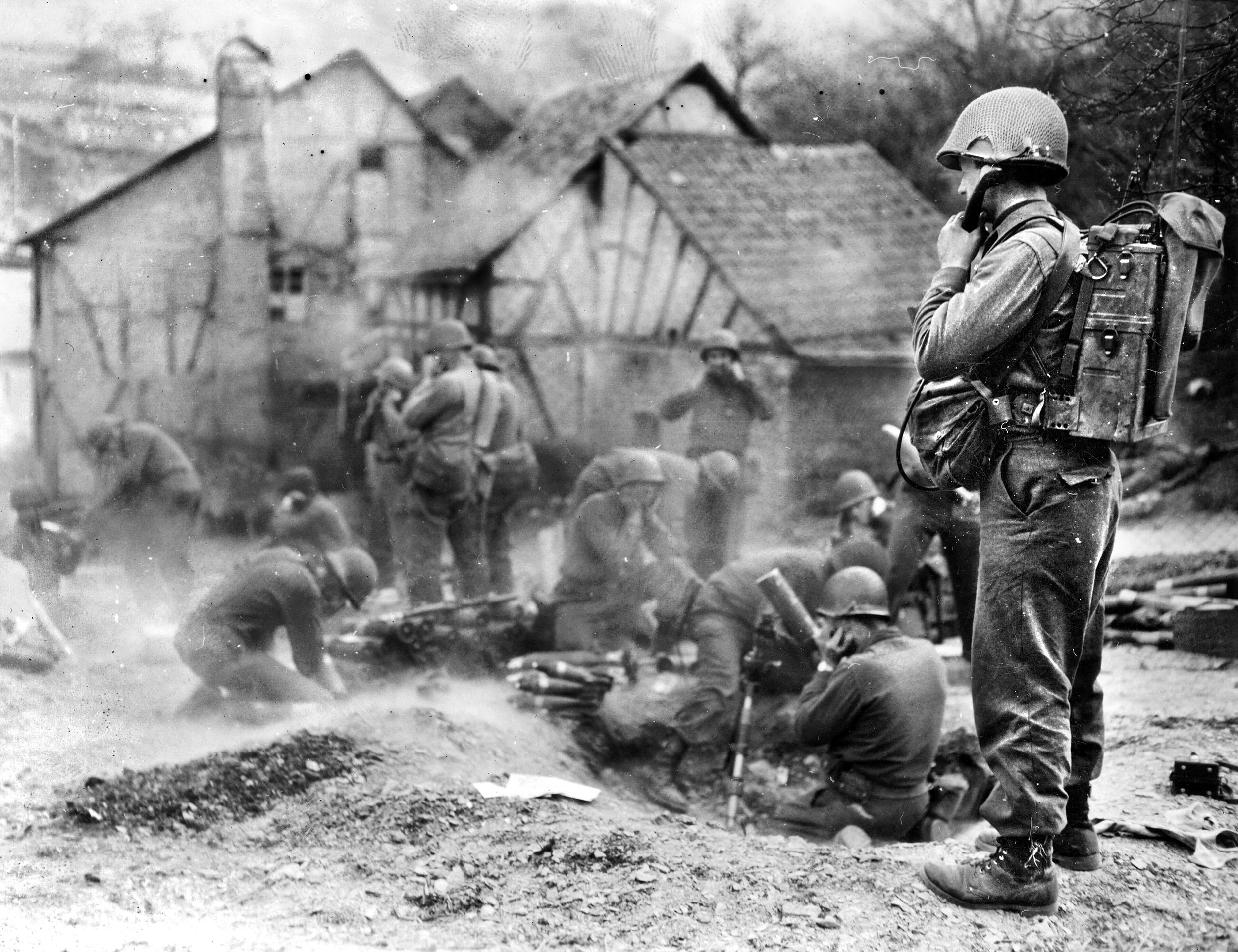 Infantry from the 10th Armored Division fire at retreating Germans outside the village of Gronig. Having used up much of their strength fighting the Battle of the Bulge and defending the Rhine River, the German army had little left to stop Patton’s advancing tanks and infantry.