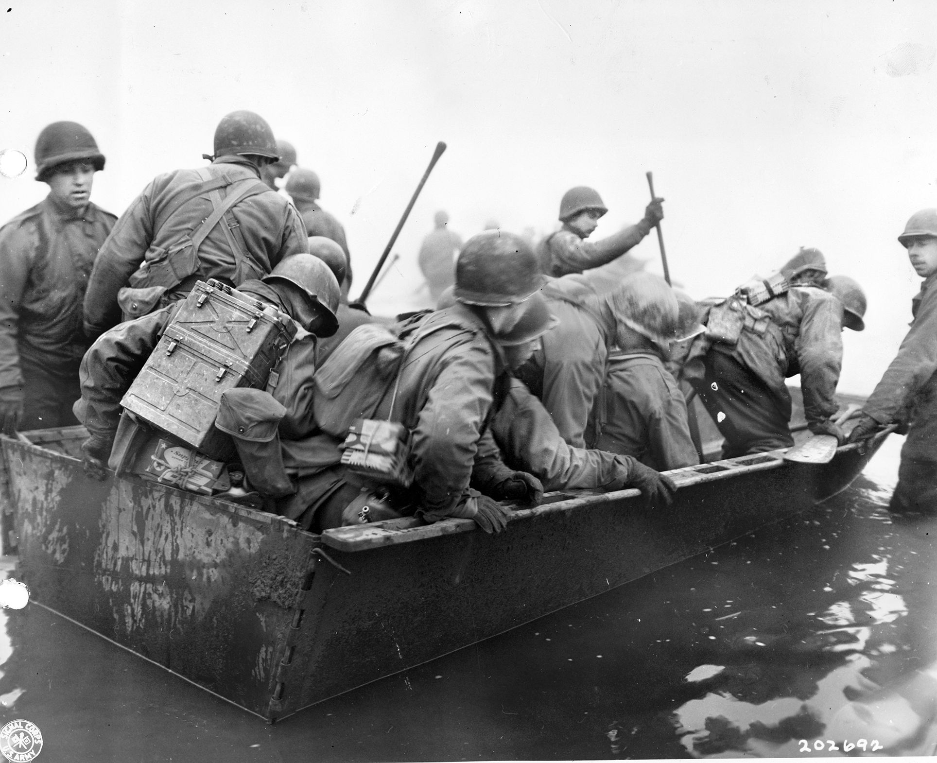 Darkness protected the initial river crossing, with men in assault boats like these launching at 10 p.m. on March 22, 1945. Betting on surprise, Patton used neither artillery or tank fire to support the crossing.