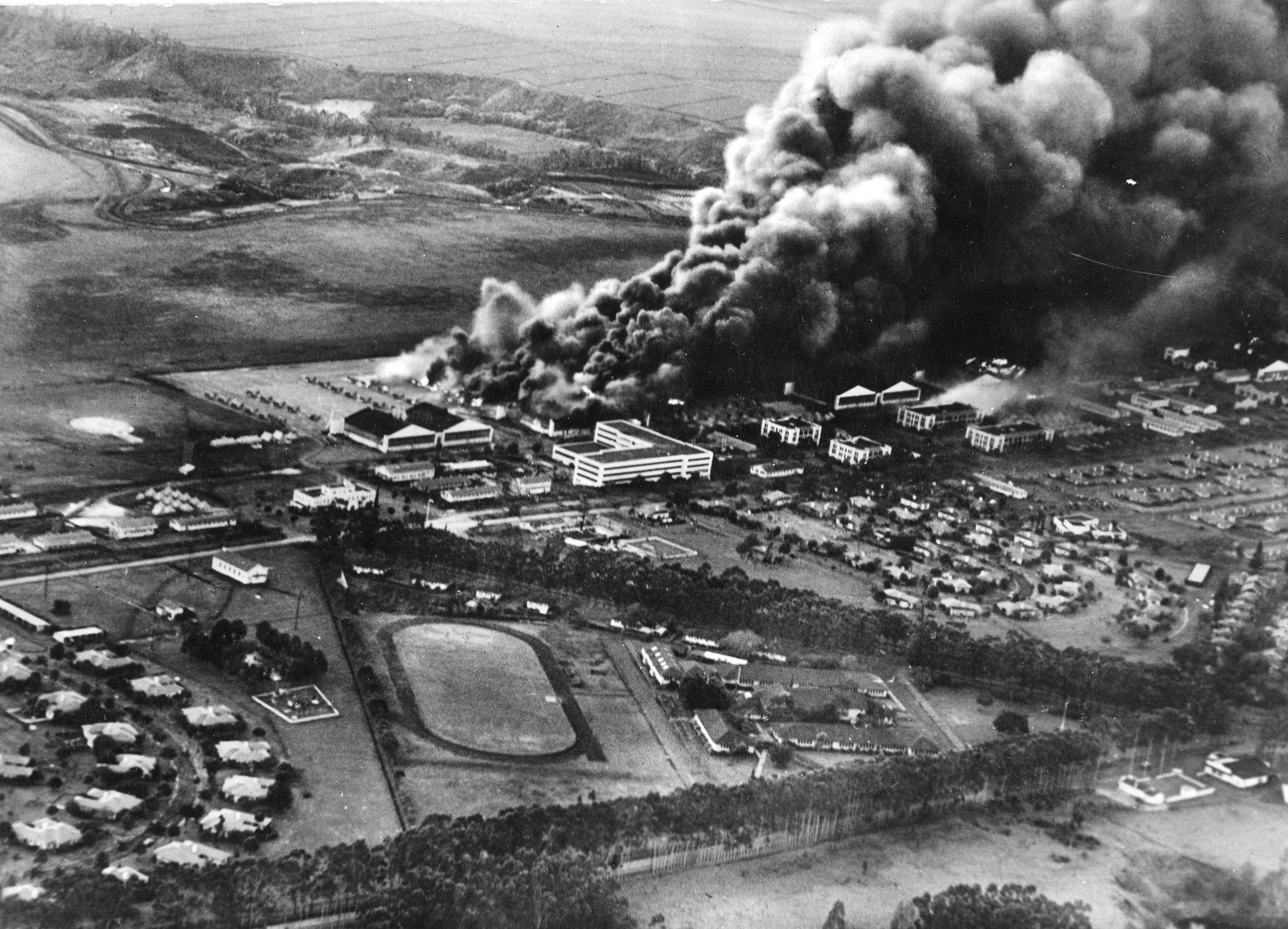 Installations at Wheeler Airfield on the island of Oahu burn furiously on the morning of Sunday, December 7, 1941. In the wake of the Japanese attack on Pearl Harbor and other military installations on the island, soldiers like John Sanford Baird, who was stationed at Wheeler, spent a long day anticipating an amphibious landing or renewal of the air attacks.