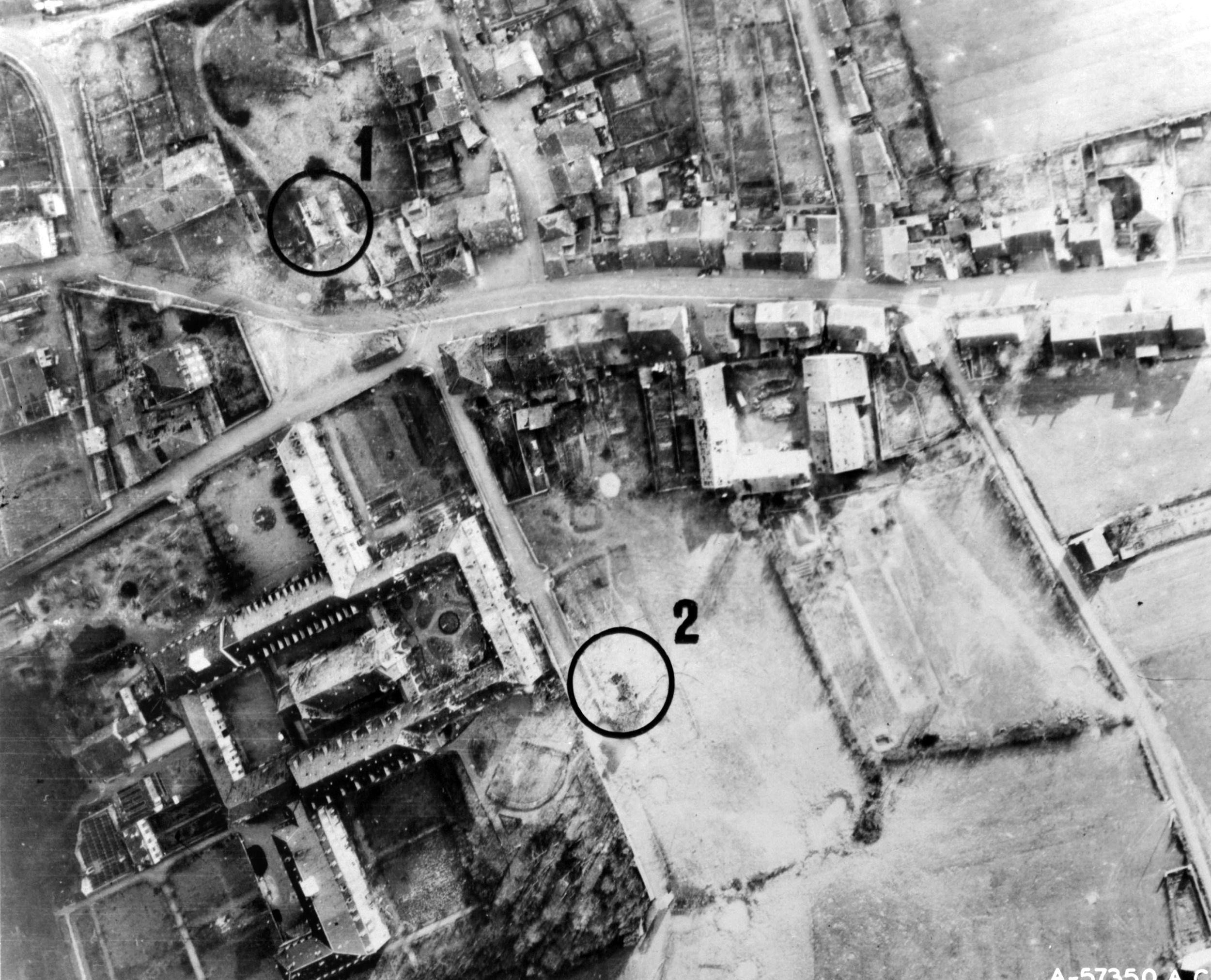 This aerial photo identifies targets for the P-47 fighter-bombers from the 405th Fighter Group at Peltre, France. Flying on the deck to improve precision, the pilots had to pull up sharply to avoid clipping local buildings as they hit target 1, the G-2 intelligence section of the 17th Panzergrenadier Division, and target 2, the division’s headquarters.