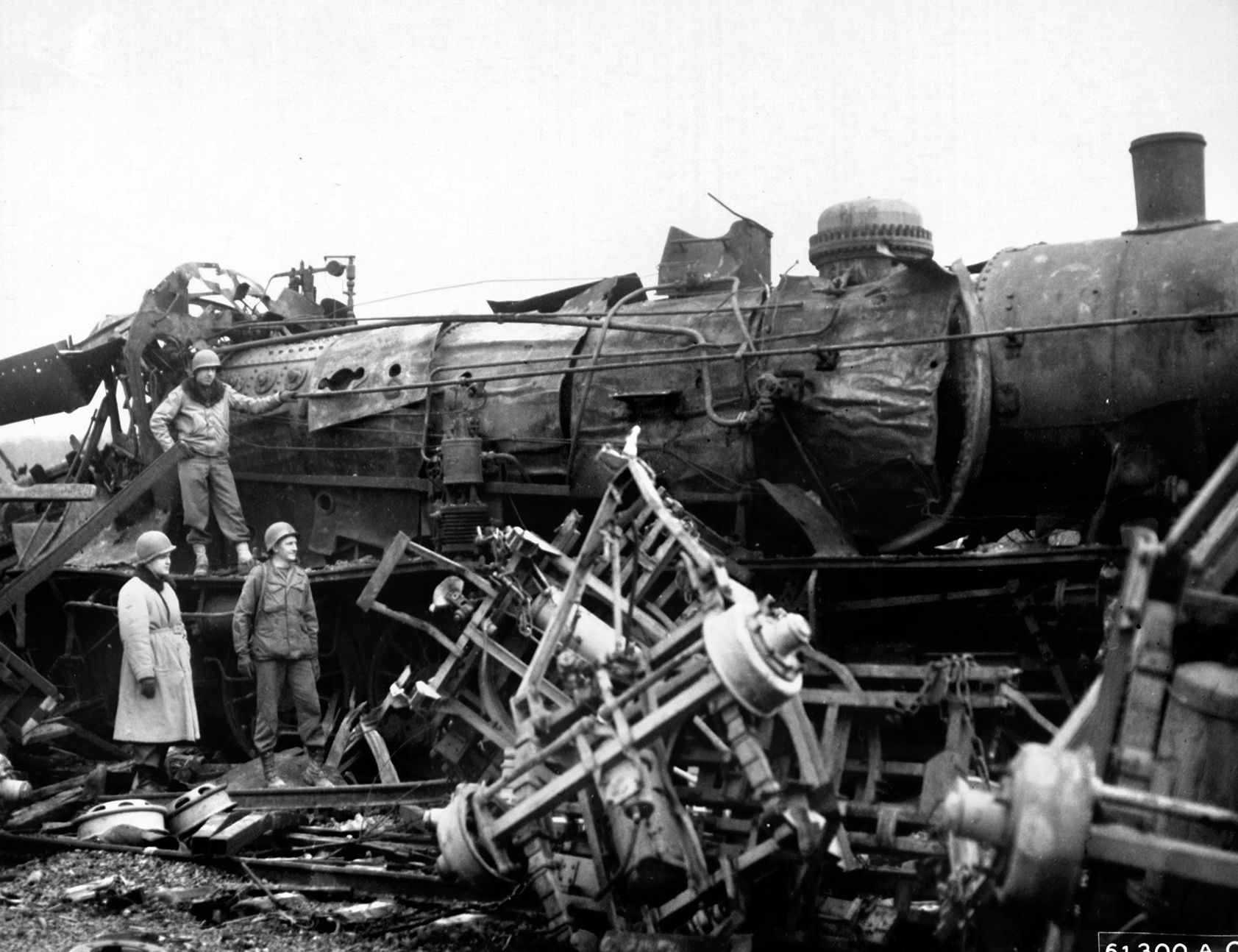 A derailed locomotive chokes a railyard after a relentless interdiction strike by the XIX Tactical Air Command during the run-up to D-Day. Targeting critical transit centers crippled German mobility, trapping crucial military supplies in place and preventing the Wehrmacht from shifting its forces to counter advancing Allied columns.