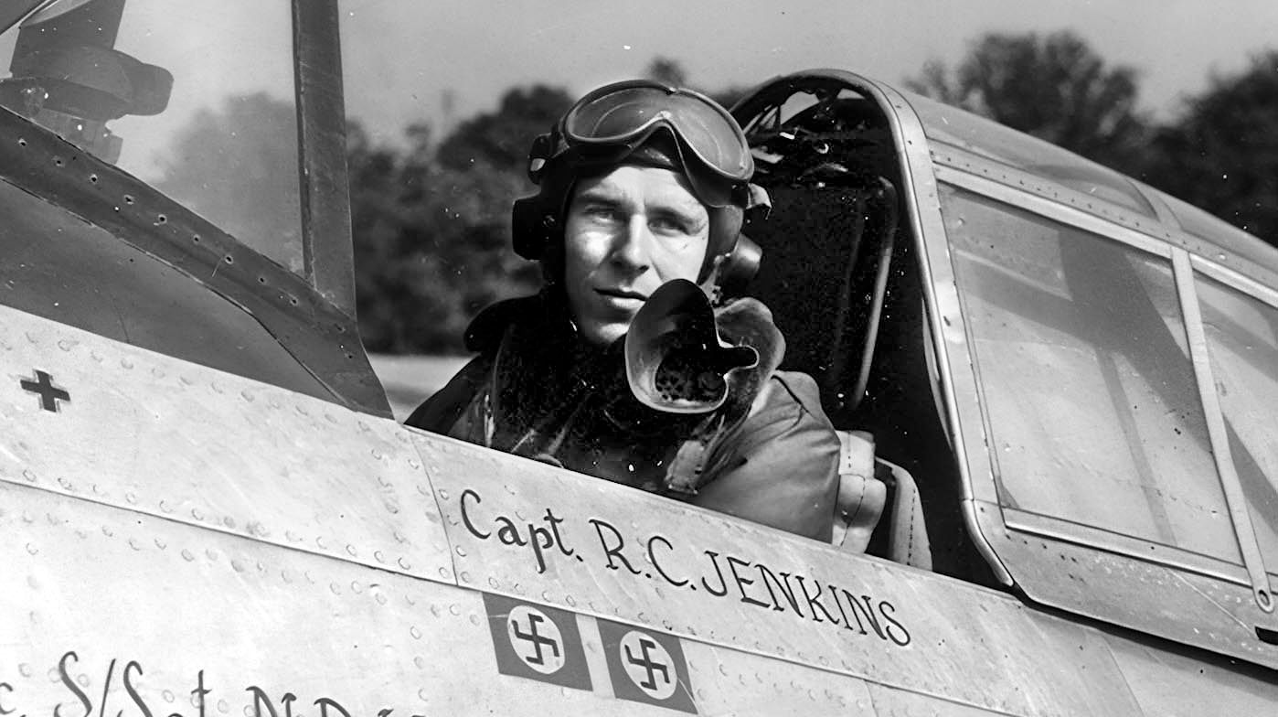 United States Army Air Force Captain Ralf Jenkins (later Colonel) in the cockpit of the Tallahassee Lassie during the war. The Swastikas circled by a red square signify air victories. Plain black Swastikas represent a ground victory.