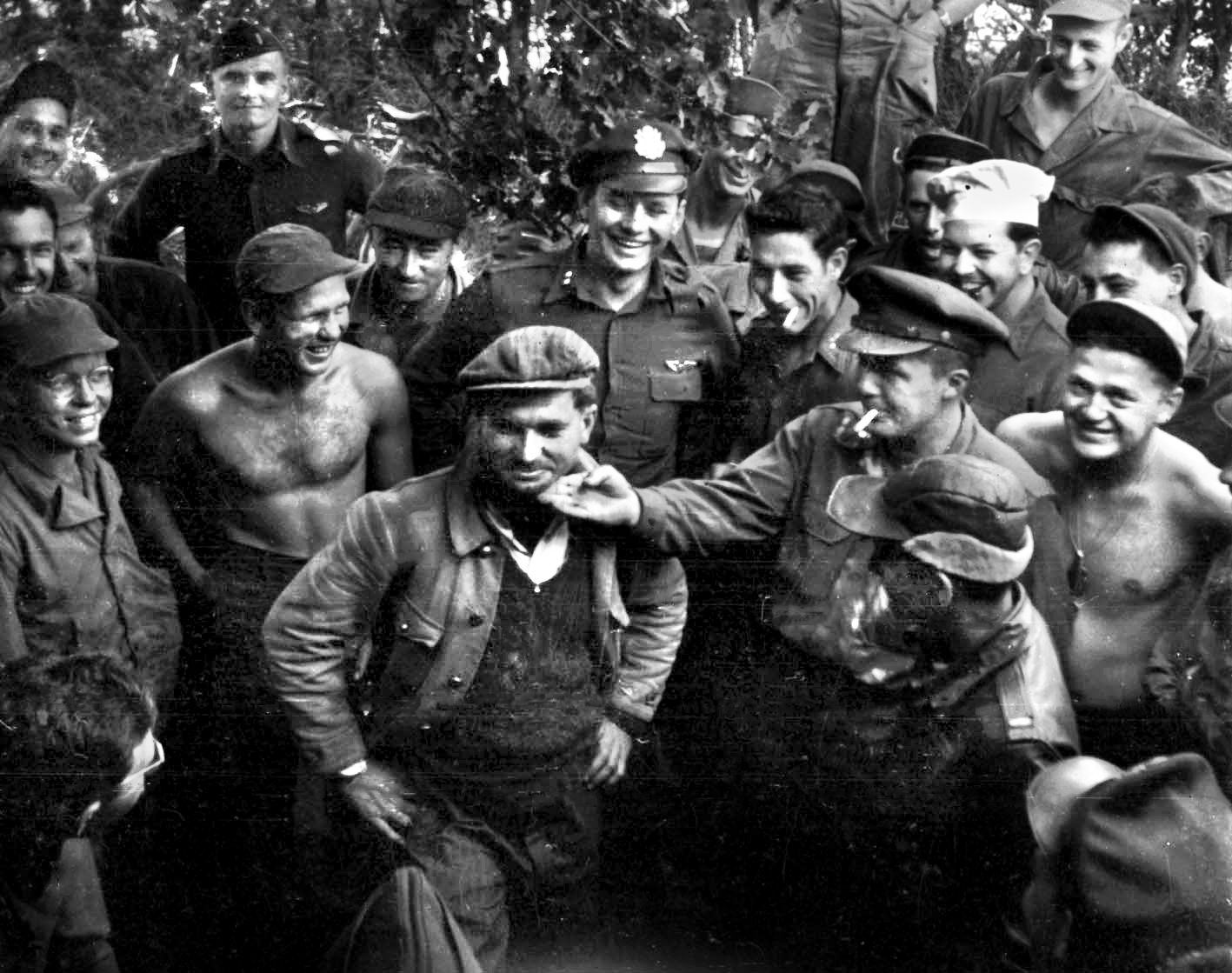 Lieutenant David “Deuce” Hamilton is welcomed back to his squadron after his P-47 was forced down behind German lines. Like many others, Hamilton was helped by a network of French civilians who routinely risked their lives to help downed Allied airmen bypass Wehrmacht patrols and make it back to friendly lines.