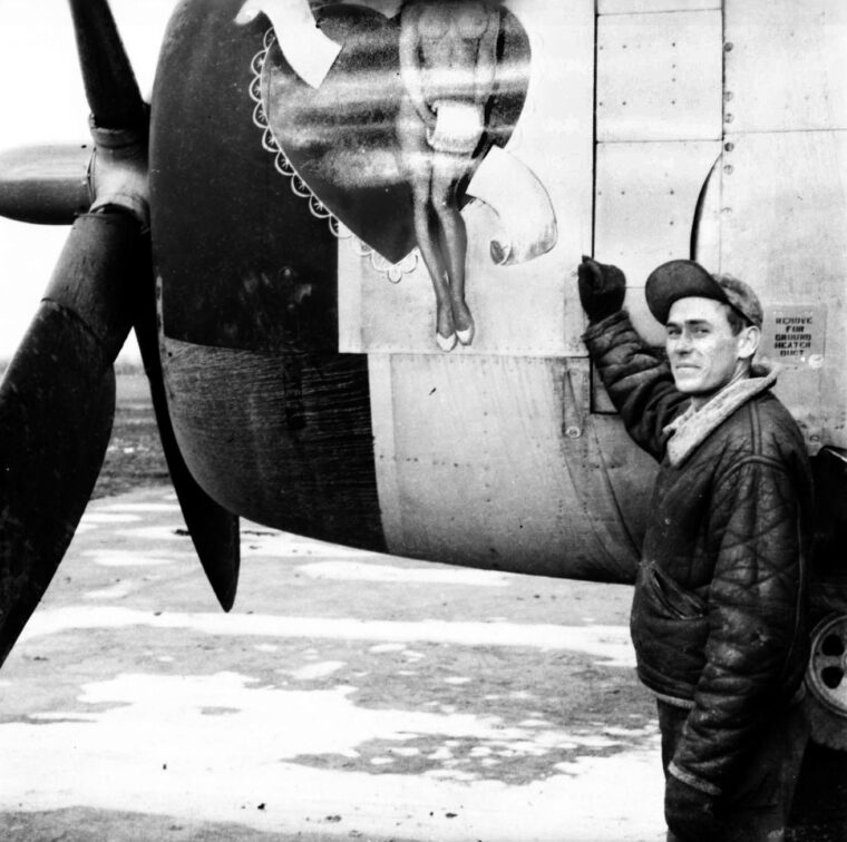 Operations specialist Sergeant Lynn Trank poses with one of the nose art designs he painted on a P-47 Thunderbolt. In the high-stress environment of tactical fighter groups, such custom personalizations boosted morale for the pilots and the ground crews. Trank’s artwork transformed rugged eight-ton machines into symbols of individual identity and American defiance, making him one of the most popular men on the airfield.