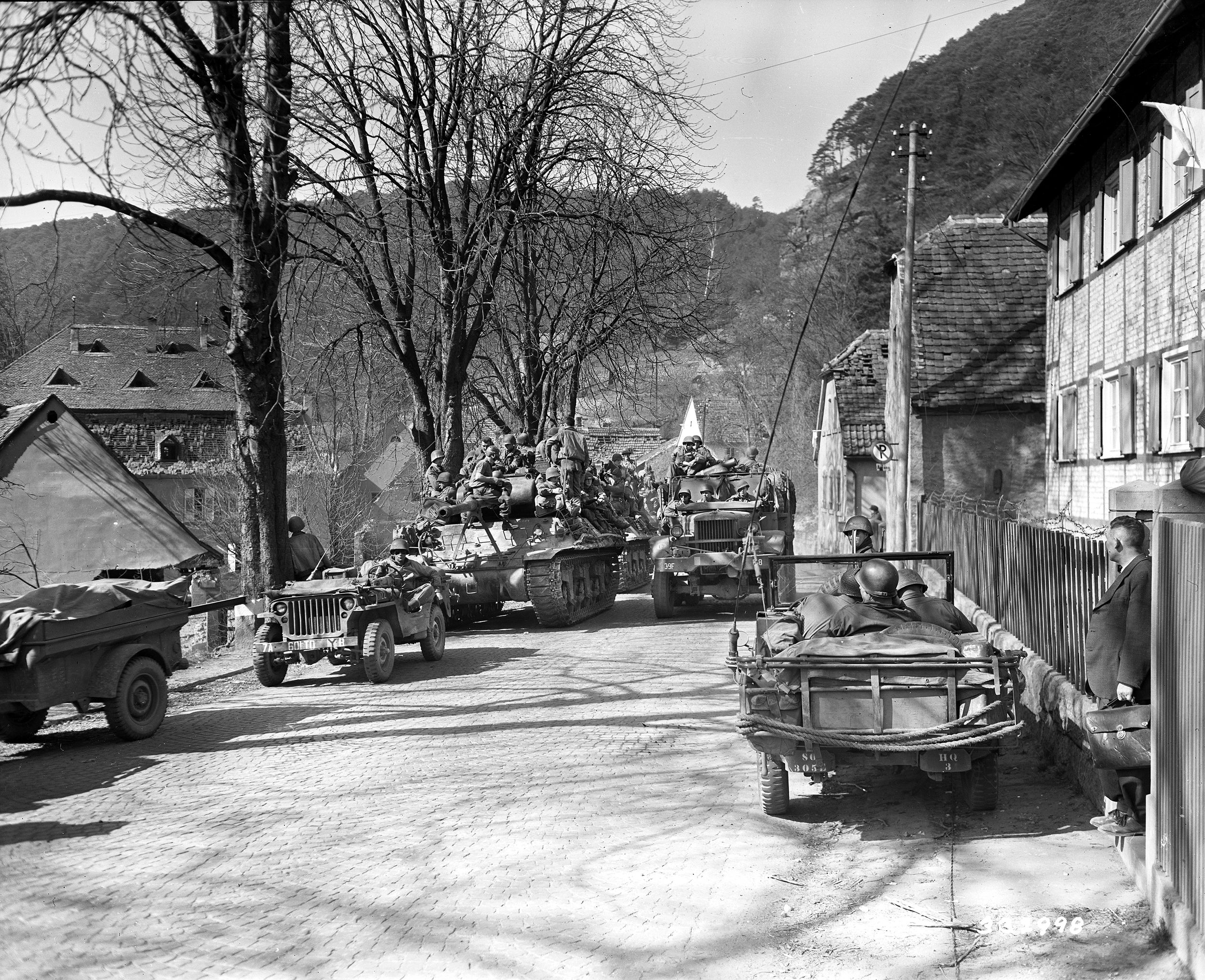 Tank destroyers attached to the 3rd Infantry Division of the U.S. Seventh Army roll down the Bad Dürkheim–Ludwigshafen Highway on March 23, 1945, as the Allied offensive pushes deeper into Germany toward the vital Rhine River crossings and the chemical industrial hub of Ludwigshafen.