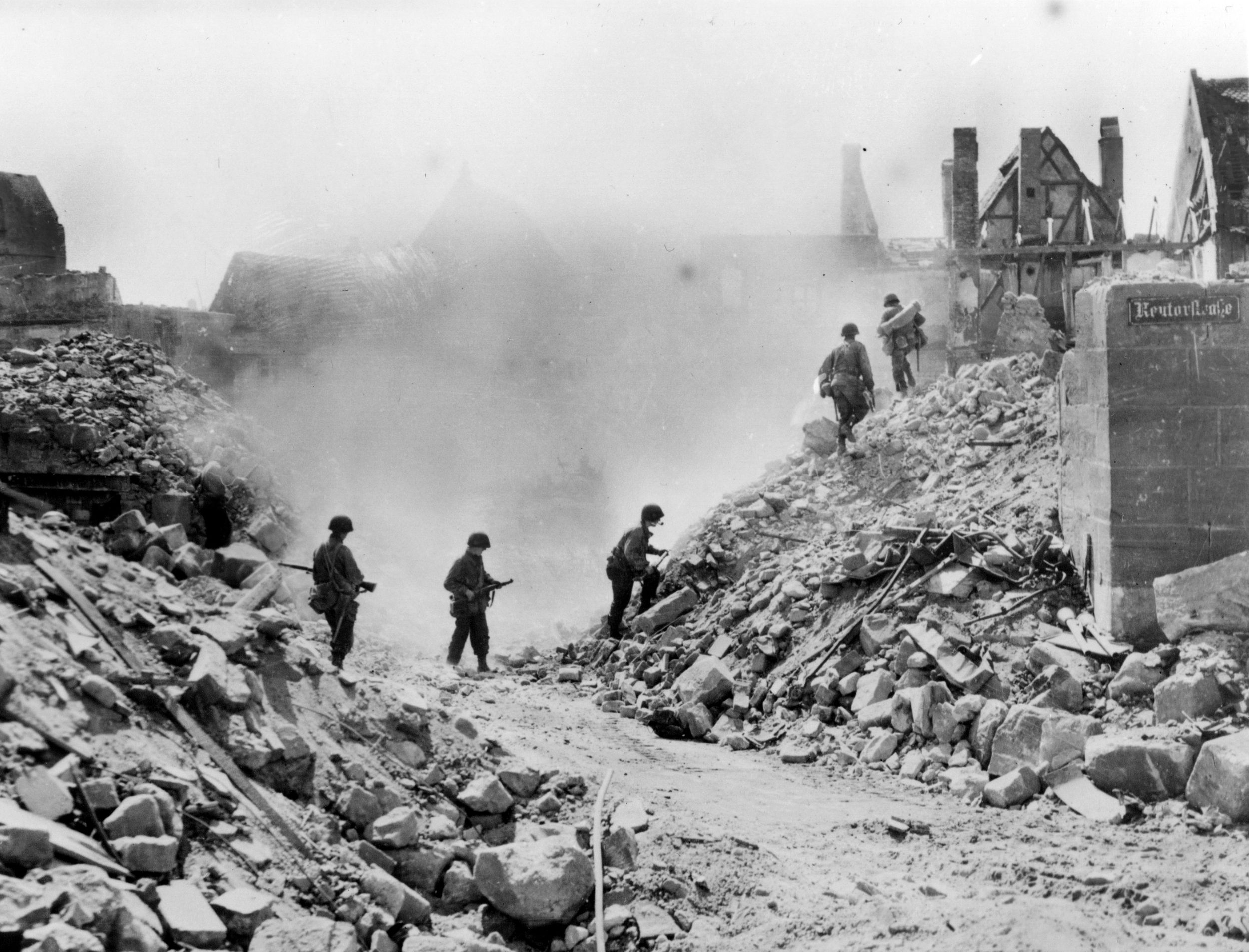 Soldiers of the 3rd Infantry Division, U.S. Seventh Army, navigate the streets of Nuremberg in late April 1945. Following five days of heavy urban combat and the city's fall on April 20, these “Rock of the Marne” infantrymen transitioned to the perilous task of mopping up final pockets of German snipers and die-hard holdouts entrenched within the city’s ruins.
