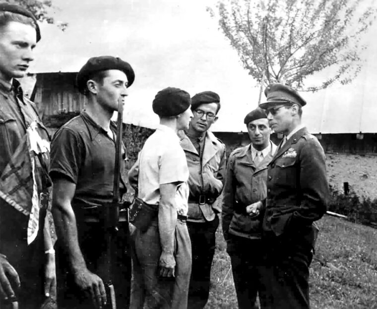 U.S.M.C. Major Peter J. Ortiz, working as part of Operation Union II for the Office of Strategic Services (OSS) in cooperation with the British Special Operations Executive (SOE), inspects members of the French maquis near Albertville, France, August 7, 1944.