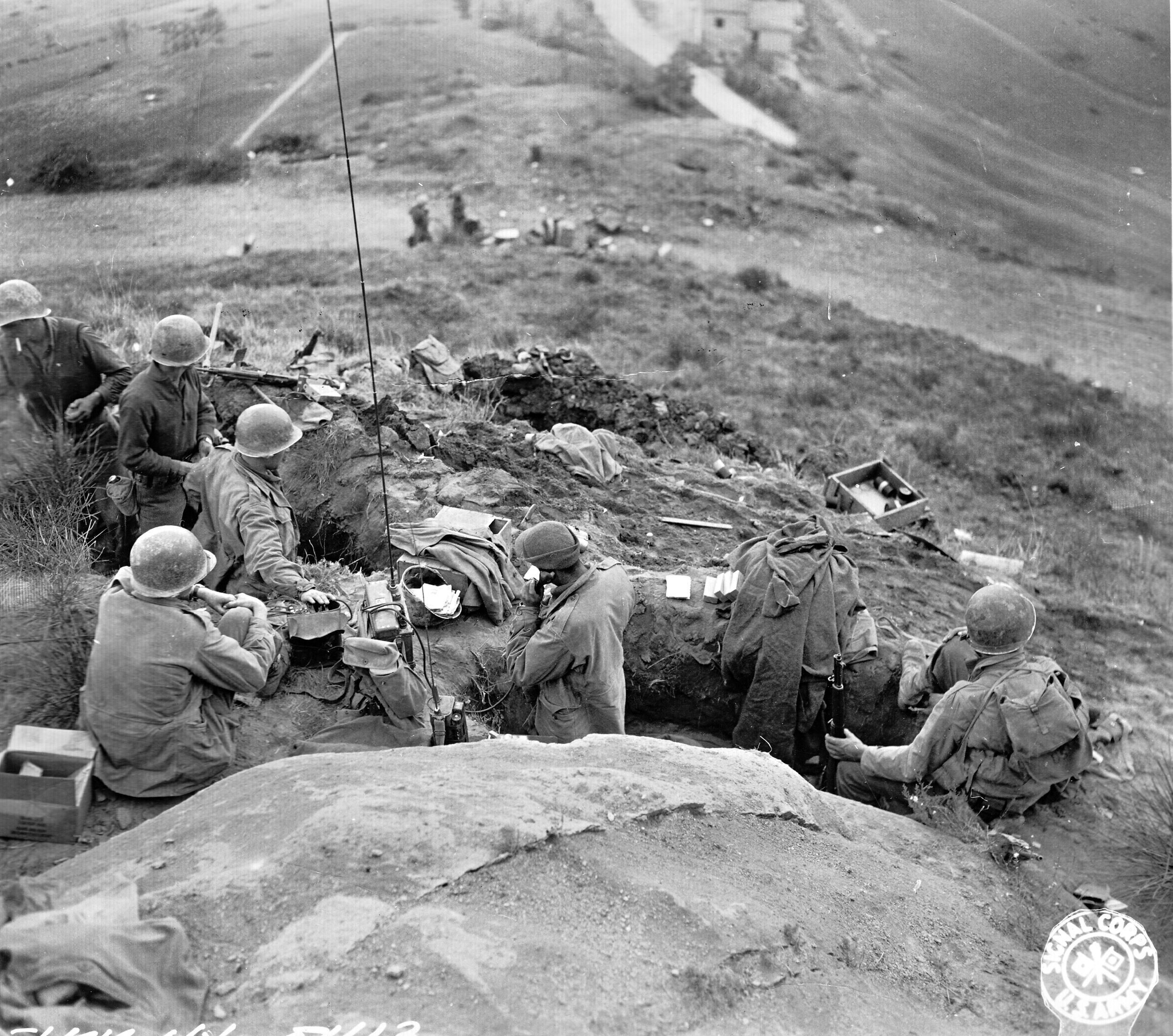 Troops of the 91st Infantry Division man entrenchments near the village of Livergnano along Highway 65. The fighting here lasted October 9-15, 1944.