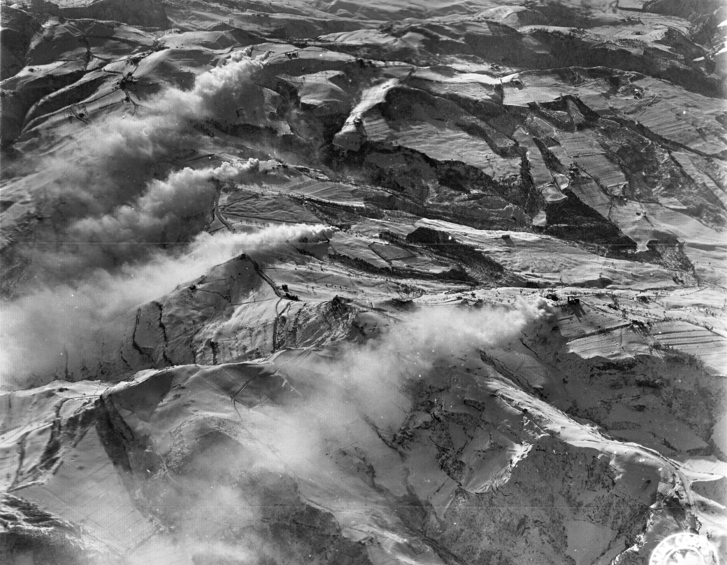 Photographed in January 1945 looking south between Livergnano and Highway 65, the snow-covered Apennine Mountains showcase the German second line of defense commanding the mountain routes to Bologna.
