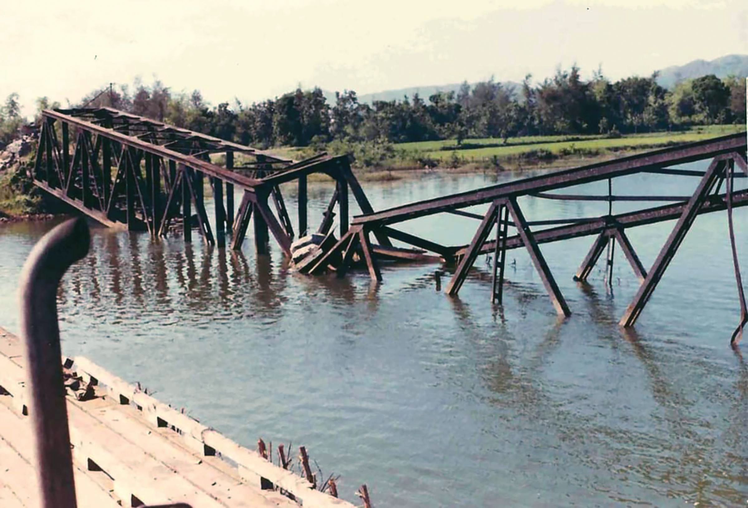 The destroyed railway bridge near Tam Ky, South Vietnam, on May 14, 1969. “We took two APCs to guard the main bridge, placing one at each end,” veteran Dan Marino recalled. “Directly next to it was a smaller railway bridge. The enemy blew the rail bridge, launching steel beams into the air. I dove under my APC as the falling beams embedded themselves vertically in the wood around us.”