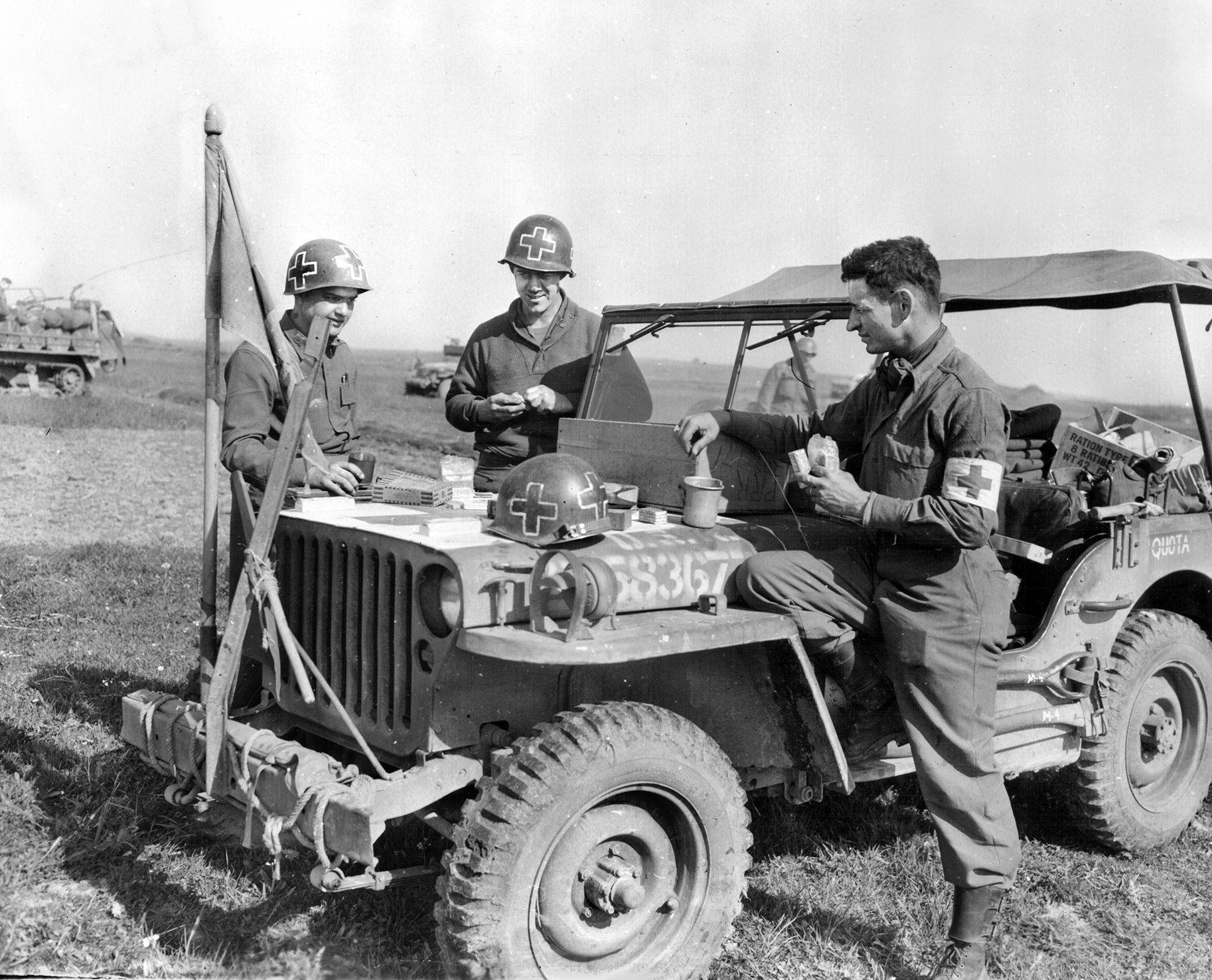 Medics of the 67th Armored Infantry Battalion, 13th Armored Division, pause for a meal during their rapid advance across southern Germany on April 29, 1945. Just four days later, their wartime journey would culminate across the Austrian border in Braunau am Inn—the town where Adolf Hitler was born in 1889.