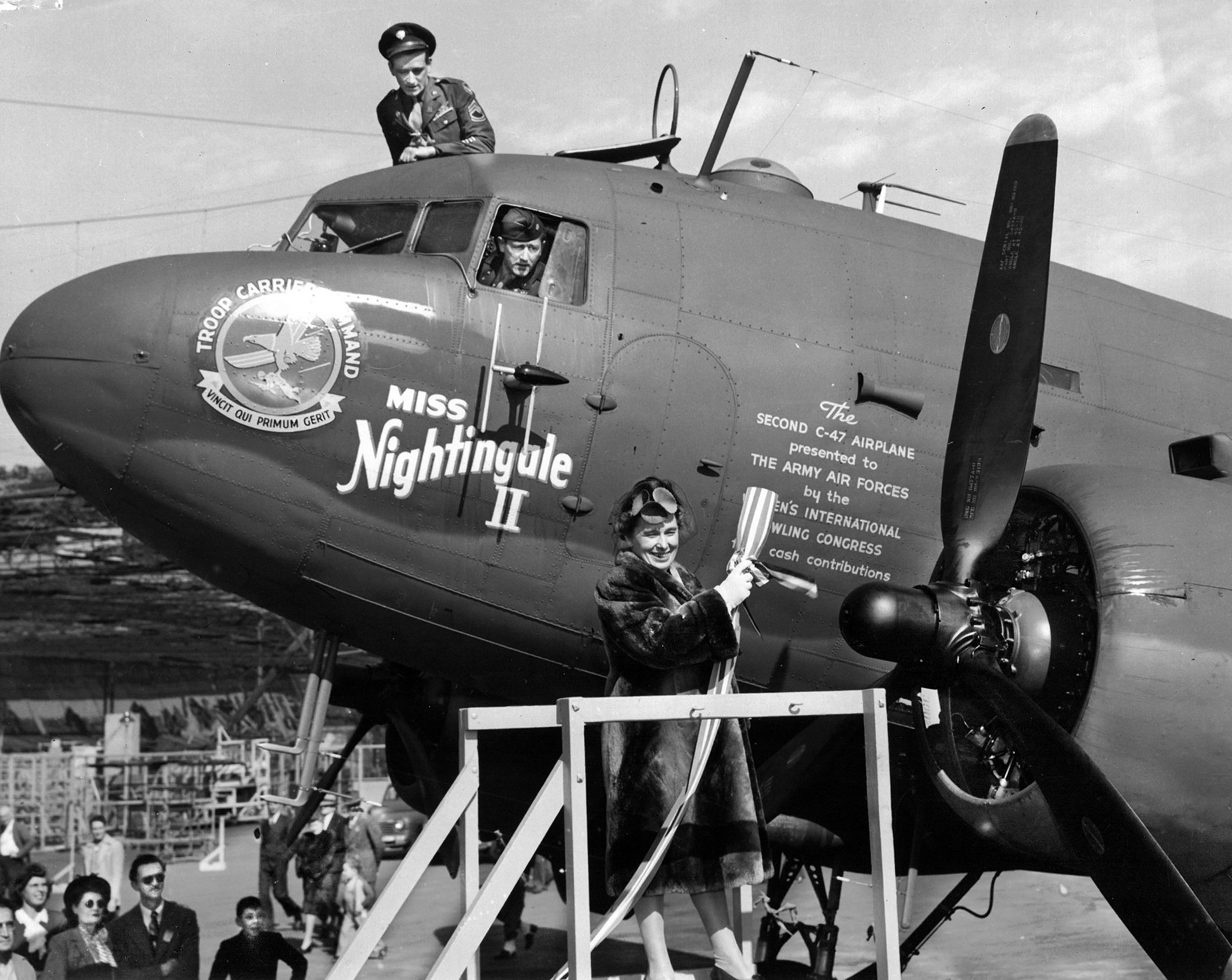 Mrs. Jeannette Knepprath, president of the Women’s International Bowling Congress (WIBC), christens the Douglas C-47 transport Miss Nightingale II at Clover Field in Santa Monica, California, in January 1945. Purchased for the U.S. Army Air Forces through the WIBC’s “Wings of Mercy” fundraising drive, it was the second C-47 donated by the organization. The aircraft was dedicated to the memory of 2nd Lt. Ruth M. Gardiner, the first American flight nurse killed in the line of duty during World War II.