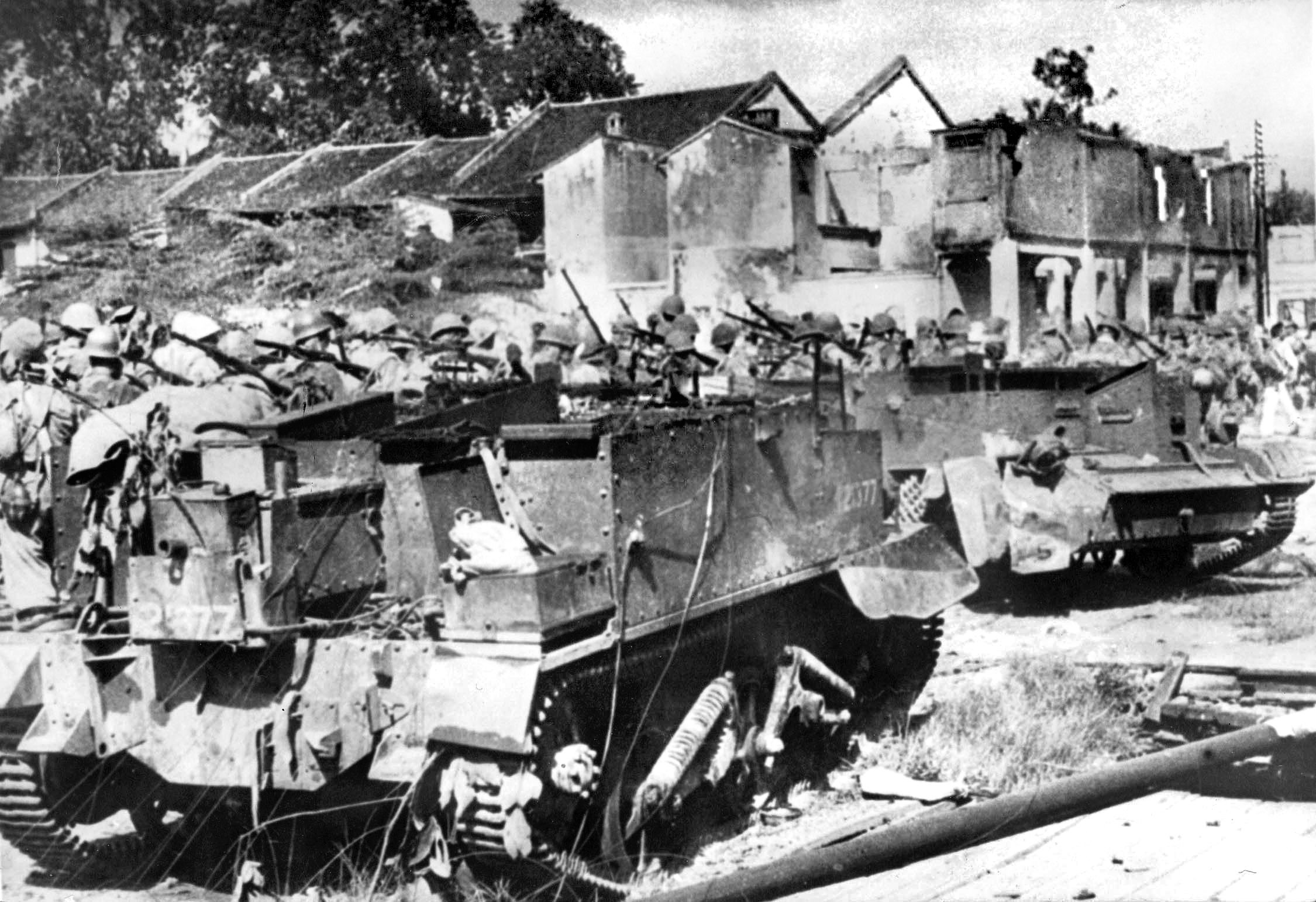Japanese infantrymen march past disabled British Universal Carriers during their rapid advance toward the ridge-top village of Kohima in April 1944. Executing the northern thrust of Operation U-Go, Lt. Gen. Kōtoku Satō’s 31st Division moved swiftly through the mountainous jungle terrain of the Assam borderland, overrunning thin outposts and quickly encircling the strategic hamlet to sever it from Allied reinforcements and supply lines.