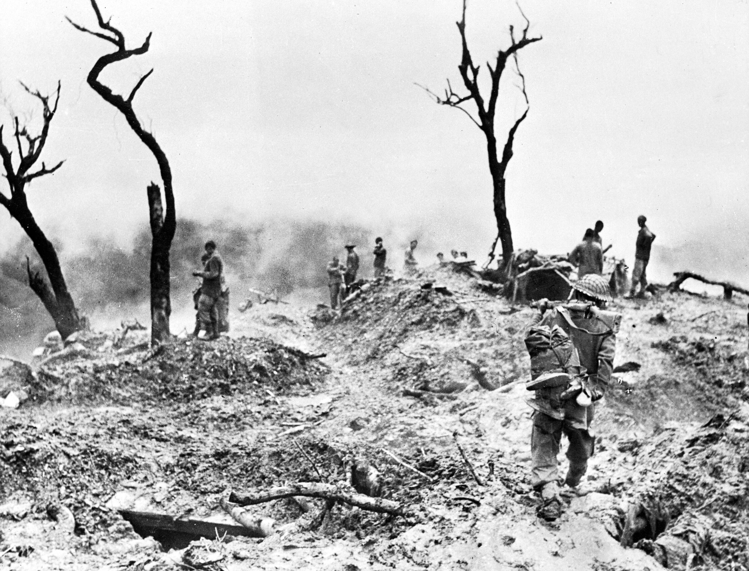 Destroyed bunkers, scattered equipment, and dead Japanese soldiers litter the slopes of “Scraggy Hill” in the Shenam area following its capture by the 10th Gurkha Rifles. The formidable position commanded a vital choke point along the southern approaches to Imphal and was only taken after relentless, close-quarters combat against the deeply entrenched defenders.